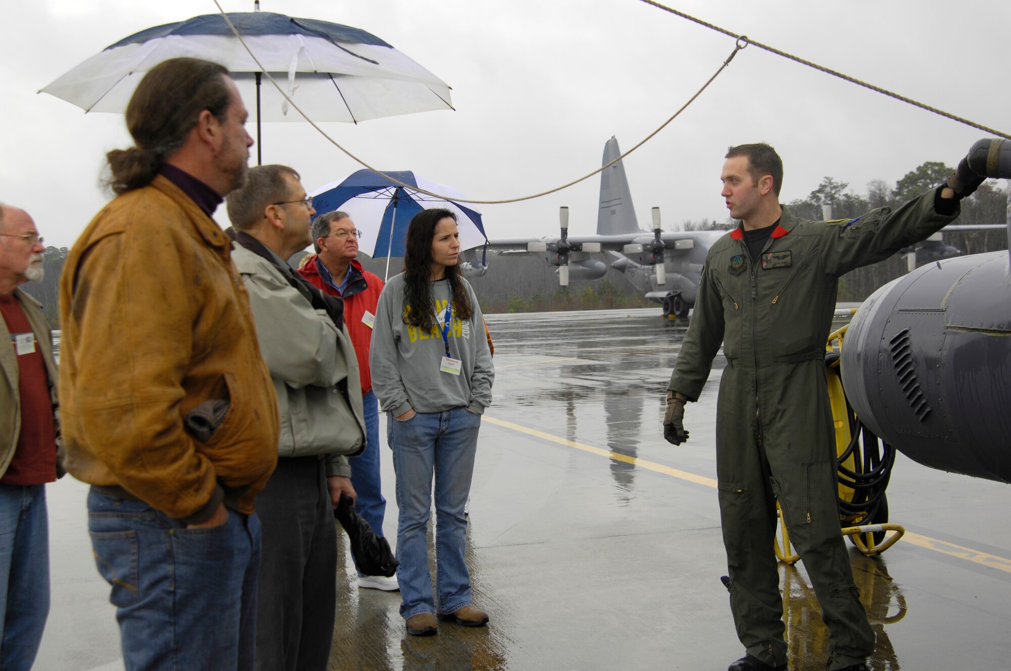 Senior Airman Justin Jewell, 20th Special Operations Squadron, explains different features of the MH-53 PAVE LOW to a group of local educators Jan. 26. The 32 teachers were participating in the 6th Annual Air Force Association Teachers Workshop, which is intended to familiarize them with Hurlburt's mission and the Air Force in general. It also provides them with tools to help them introduce aerospace education into their classrooms. (U.S. Air Force photo/Airman 1st Class Sheila DeVera)