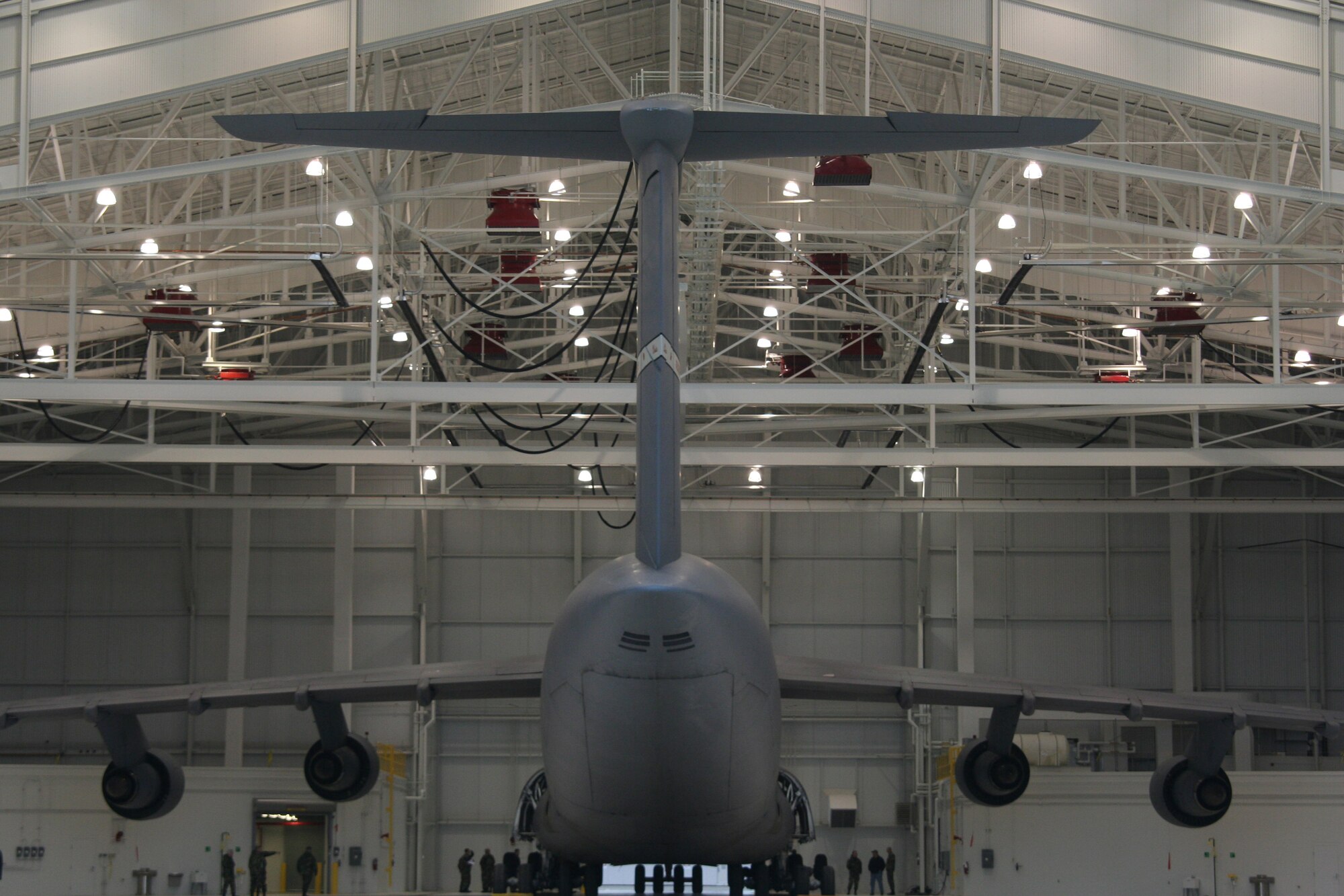 WRIGHT-PATTERSON AFB, Ohio - A C-5 is towed into the shiny new 445th Airlift Wing's Multi-Purpose Hangar for the first time Jan. 29, 2008.  The new hangar is designed for unscheduled C-5 maintenance including full wash, spot paint capability, non-destructive inspection of components on the aircraft (x-ray), and aircraft jacking.  The new hangar is part of a $65 million construction project to accomodate the C-5 Galaxy aircraft, the largest aircraft in the Air Force inventory.  (U.S. Air Force Photo/Laura Darden)