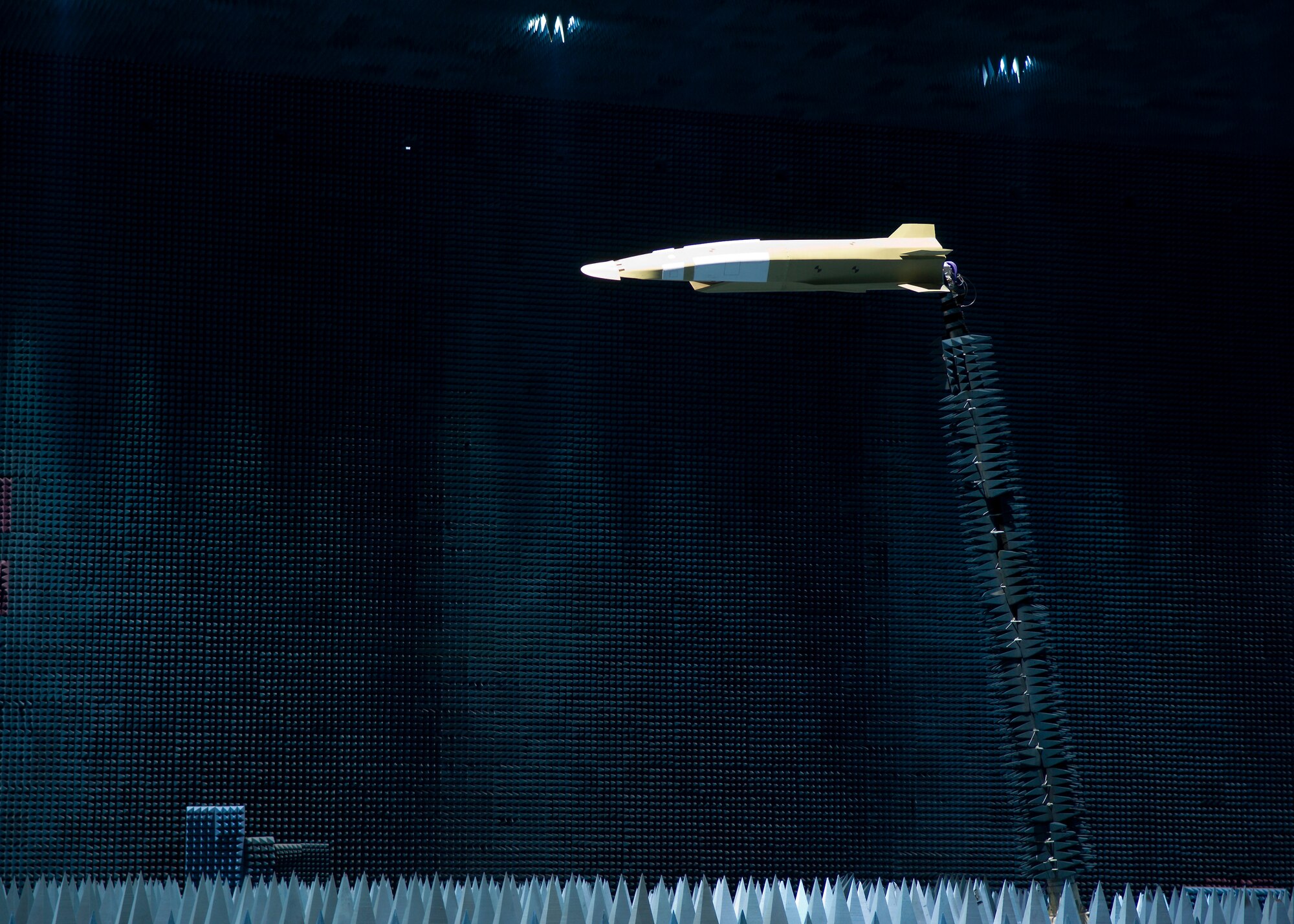 An X-51 Scramjet-Waverider mock-up hangs inside the Benefield Anechoic Facility here during the vehicle's antenna testing. The 412th Test Wing Hypersonic Flight Test Team, Electronic Warfare and Boeing began the monthlong testing Jan. 28. (Photo by Mike Cassidy)