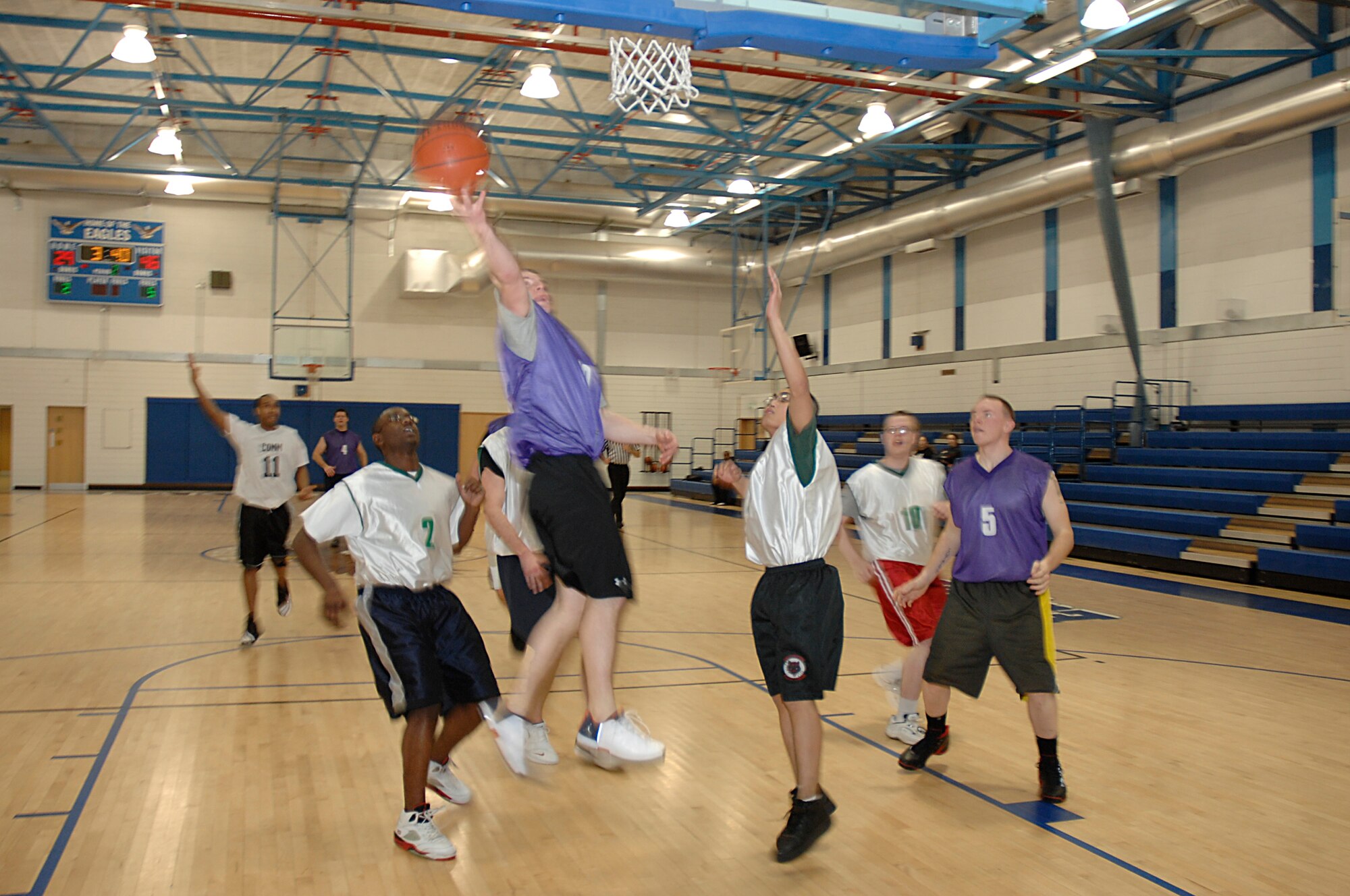 Jason Madigan, 48th Civil Engineer Squadron, goes in for a lay-up during an intramural basketball game Jan. 30 at RAF Lakenheath, England. The 48th CES beat the 48th Communication Squadron 51-34. (U.S. Air Force Photo by Senior Airman Brian J. Ellis)