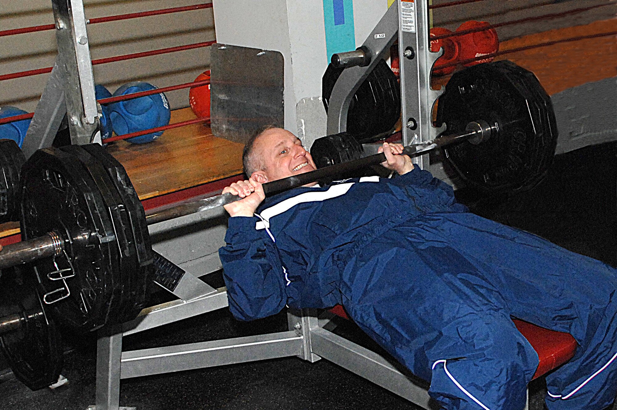 WHITEMAN AIR FORCE BASE, Mo. - Brig. Gen. Garrett Harencak, 509th Bomb Wing commander, bench presses more than 300 pounds on his quest to become Whiteman’s Biggest Loser. (U.S. Air Force photo illustration/Airman 1st Class Cory Todd)