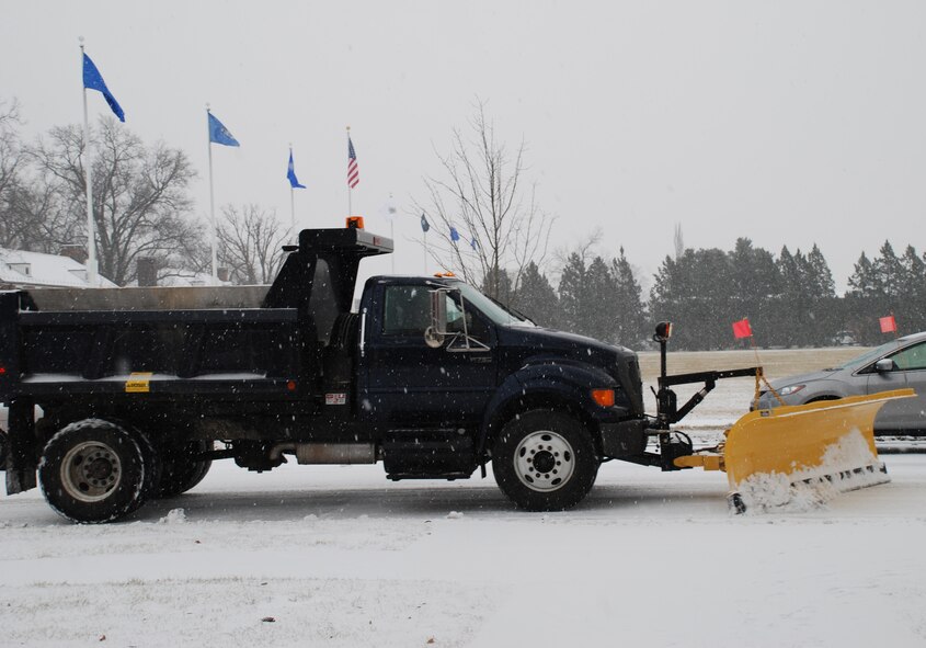 The first snowfall of 2008 brought out the snowplows.