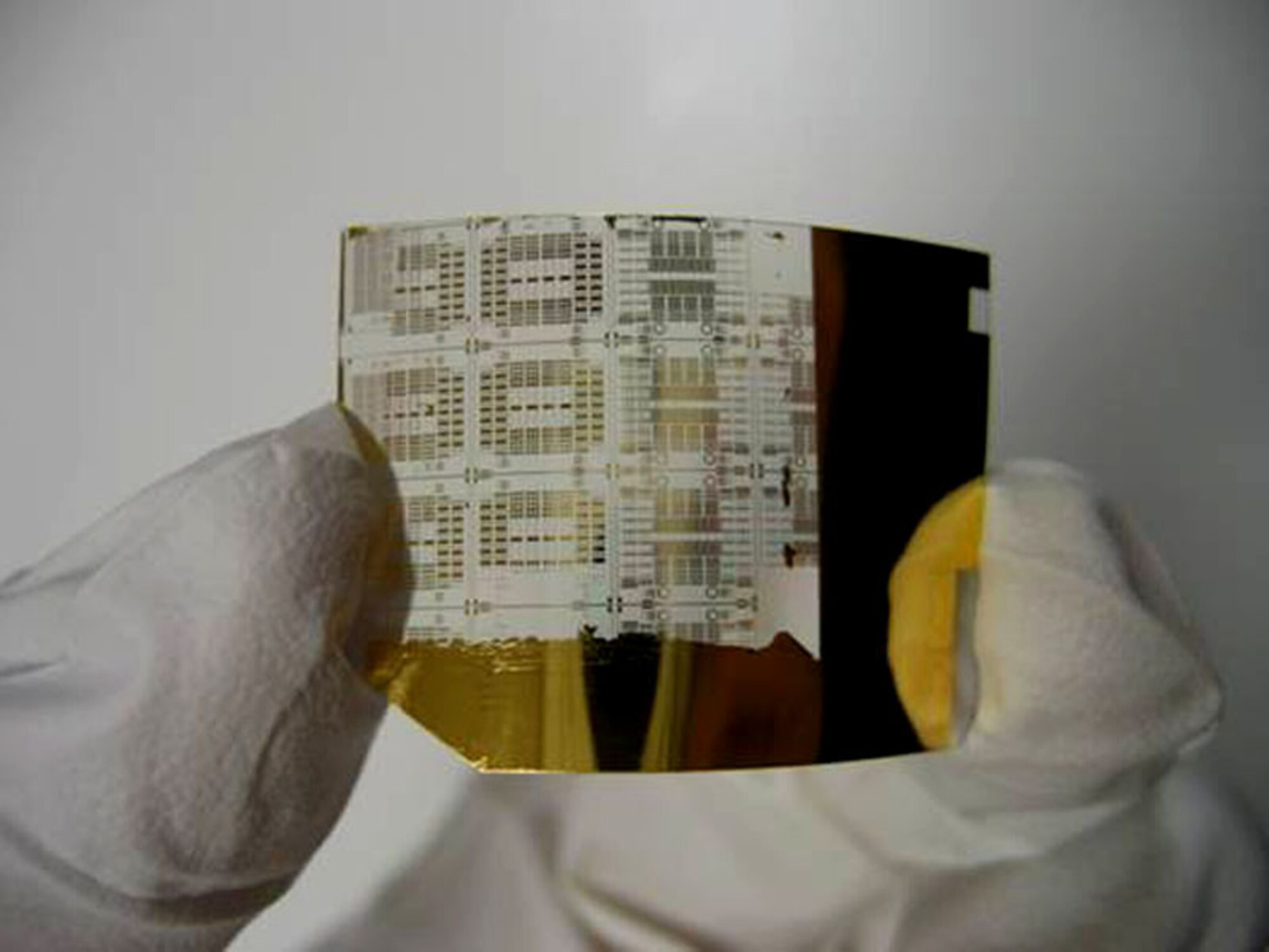 The flexibility of super-thin silicon transistors, such as the one pictured, could lead to electronics attached to unevenly shaped objects like airplane bodies or engines. Air Force Office of Scientific Research officials here recently have provided research funding for fast, bendable electronics to attach to unevenly shaped objects like airplane bodies or engines. (Courtesy photo)