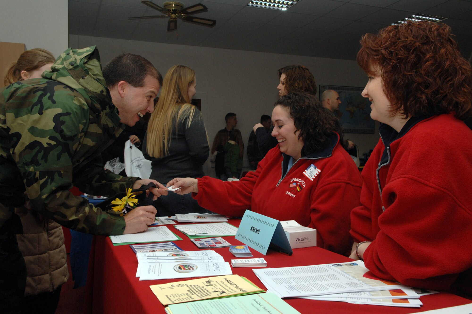 SPANGDAHLEM AIR BASE, Germany – Tech. Sgt. Ryan Helfenstein, 52nd Mission Support Squadron, speaks with members of the Spangdahlem Spouses and Enlisted Members Club, Feb. 1, 2008. They are participating in the New Year, New You event, designed to raise awareness of volunteer opportunities in the Spangdahlem community. (U.S. Air Force photo/Senior Airman Logan Tuttle)