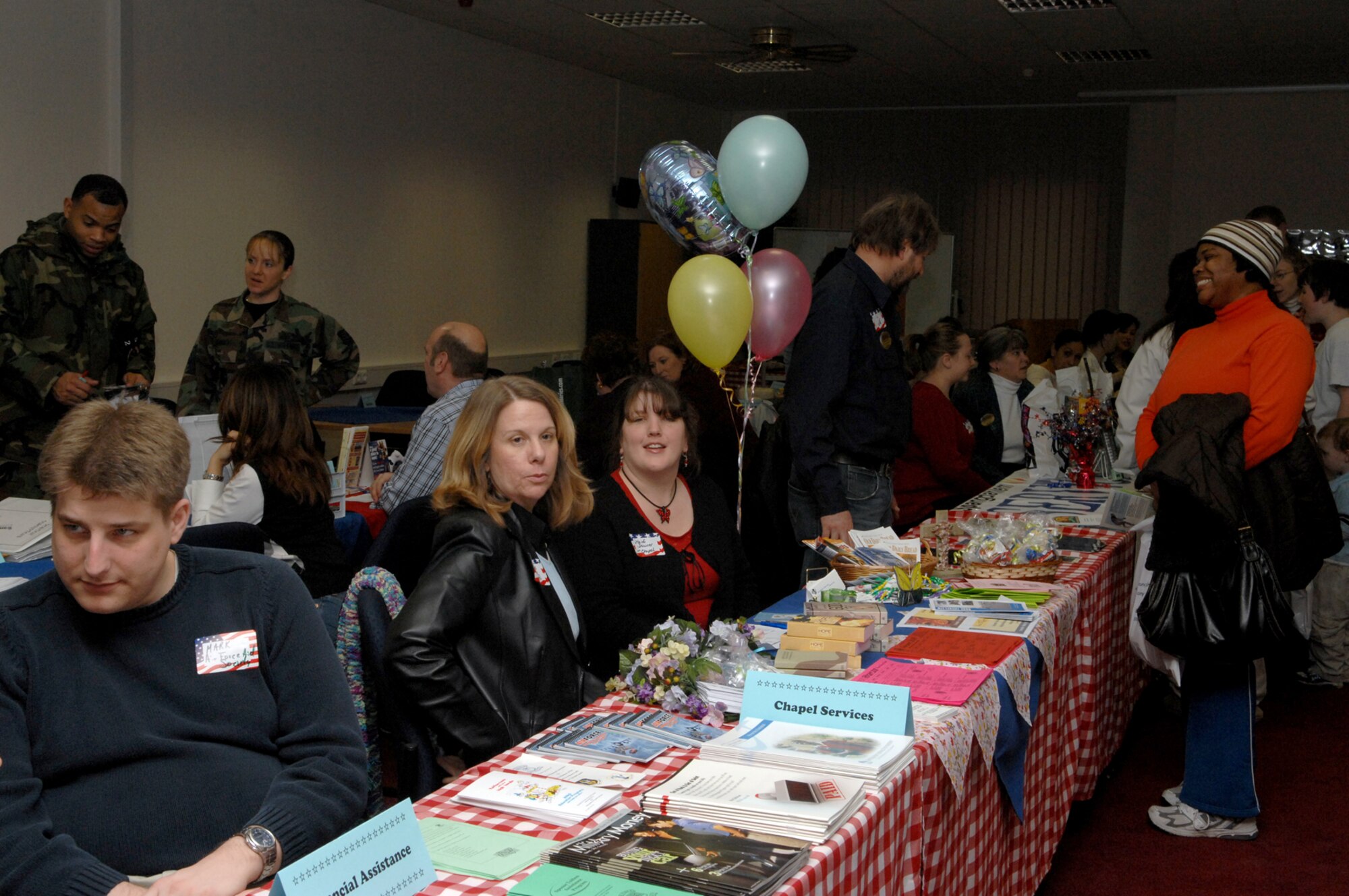 SPANGDAHLEM AIR BASE, Germany -- Members of various base organizations work at information tables at the New Year, New You event Feb. 1, 2008. The event was designed to inform members of the Spangdahlem community about various volunteer activities open to them. (U.S. Air Force photo/Senior Airman Logan Tuttle)
