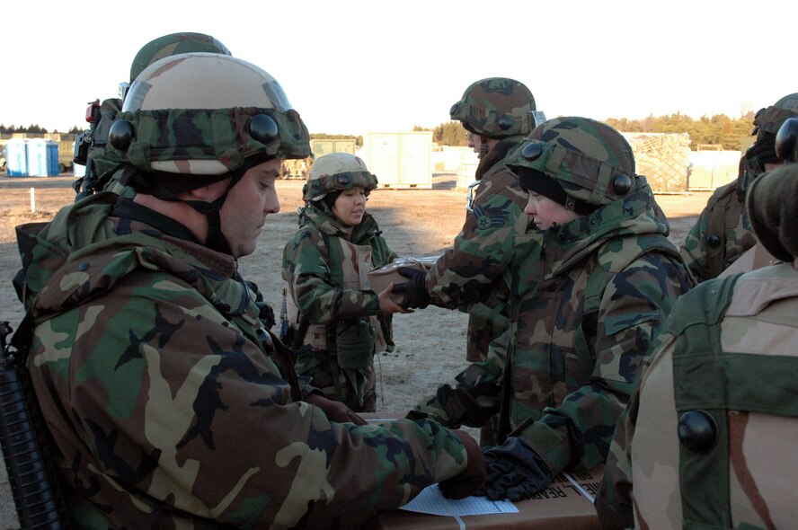 Airmen assigned to the fictional 421st Air Expeditionary Group sign out meals ready to eat packages during operations for Air Force Exercise Eagle Flag 08-2 Jan. 21, 2008, at Naval Air Engineering Station Lakehurst, N.J.  The exercise is operated by the U.S. Air Force Expeditionary Center's Expeditionary Operations School and 421st Combat Training Squadron from Fort Dix, N.J.  (U.S. Air Force Photo/Tech. Sgt. Scott T. Sturkol)