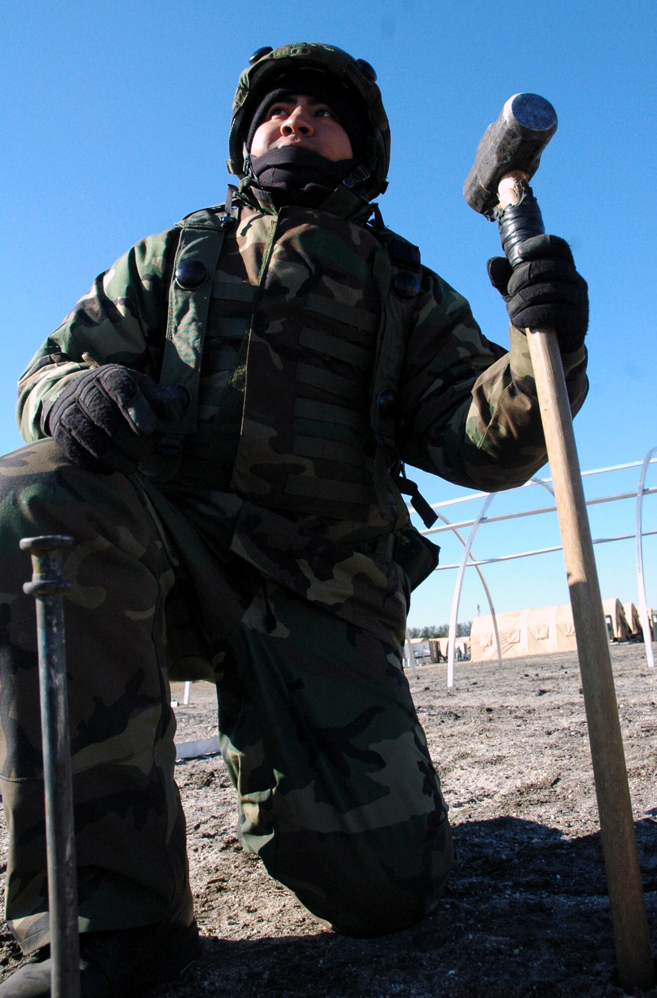 U.S. Air Force Airman 1st Class Jose Rodriguez, a civil engineer electrician from Hollomon Air Force Base, N.M., takes a break from tent building during camp build-up for the fictional 421st Air Expeditionary Group for Air Force Exercise Eagle Flag 08-2 Jan. 21, 2008, at Naval Air Engineering Station Lakehurst, N.J.  Airman Rodriguez was one of more than 400 Airmen participating in the exercise which is operated by the U.S. Air Force Expeditionary Center's Expeditionary Operations School and 421st Combat Training Squadron from Fort Dix, N.J.  (U.S. Air Force Photo/Tech. Sgt. Scott T. Sturkol)