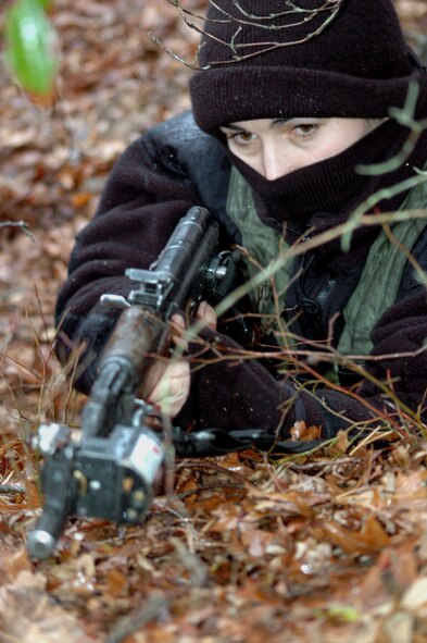 Capt. Susan Elderhorst, New Jersey Air National Guard member from the 108th Air Refueling Wing at McGuire playing the role of opposing forces, gets into position for an "ambush" on a convoy training route for the Air Force Phoenix Warrior Training Course 08-2 course Jan. 22, 2008, at Naval Air Engineering Station Lakehurst, N.J.  The course is taught by the U.S. Air Force Expeditionary Center's Expeditionary Operations School and the 421st Combat Training Squadron from Fort Dix, N.J.  (U.S. Air Force Photo/Tech. Sgt. Scott T. Sturkol)