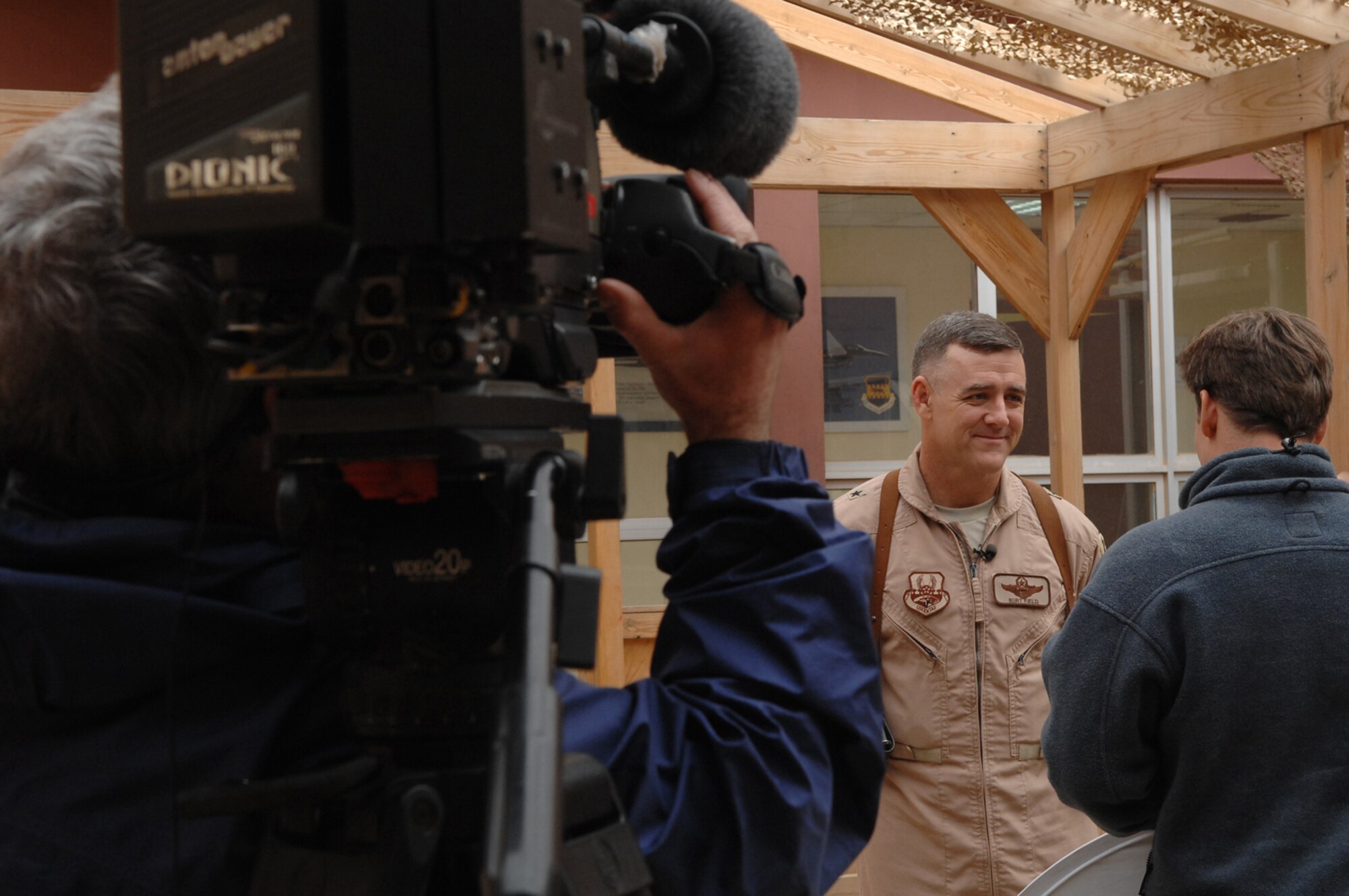 BALAD AIR BASE, Iraq -- Brig. Gen. Burt Field, 332nd Air Expeditionary Wing commander, is interviewed by NBC reporter Richard Engel, Jan. 30. The general discussed how the Army and Air Force integrate and synchronize their efforts here through Close Air Support and Intelligence, Surveillance and Reconnaissance actions. (U.S. Air Force photo/ Senior Airman Julianne Showalter)