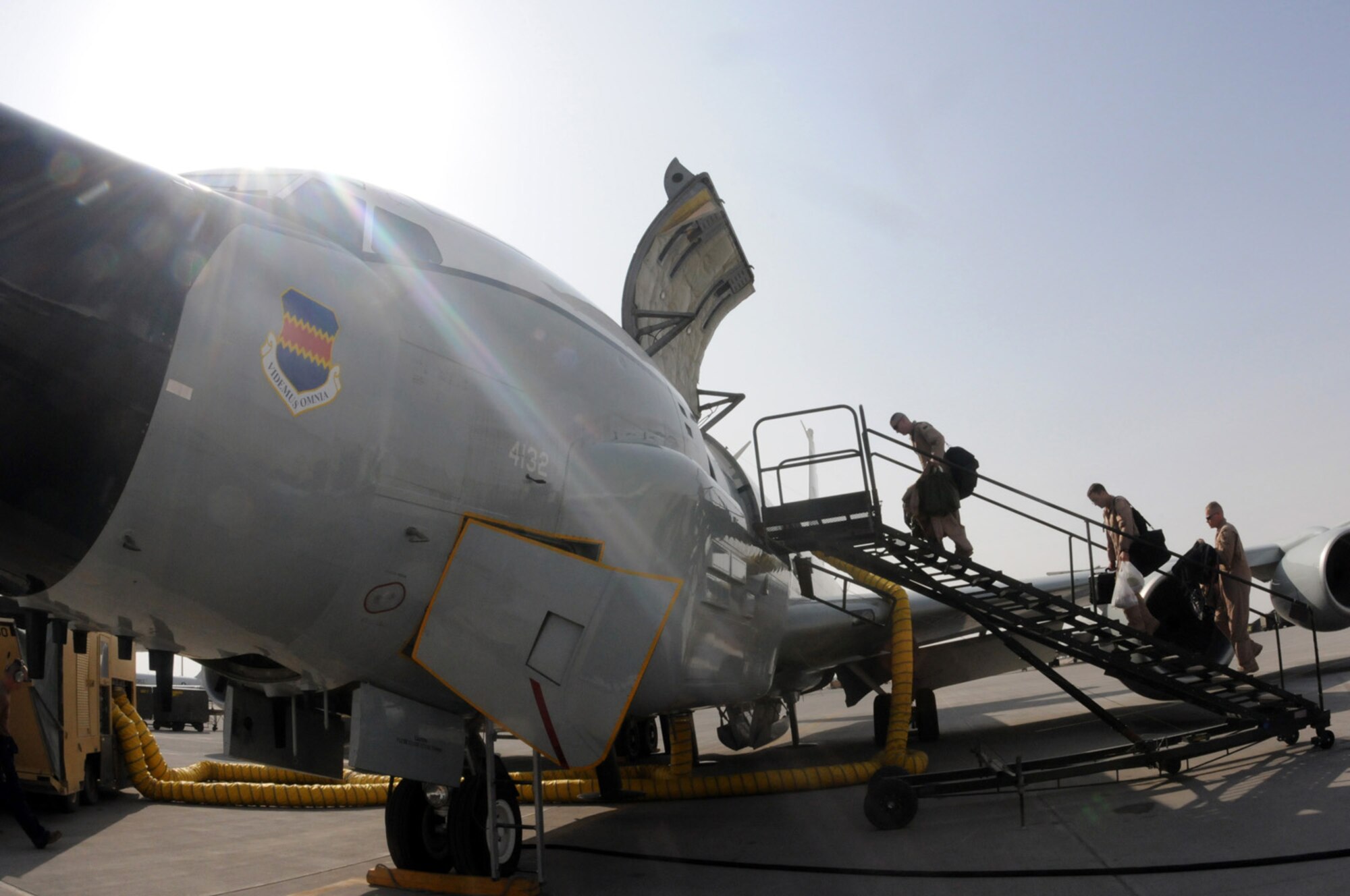 A RC-135 Rivet Joint flight crew boards to perform pre-flight preparations Jan. 30.  Cross-checks and regular maintenance are always performed prior to using the aircraft for missions. (U.S. Air Force photo/Senior Airman Domonique Simmons)