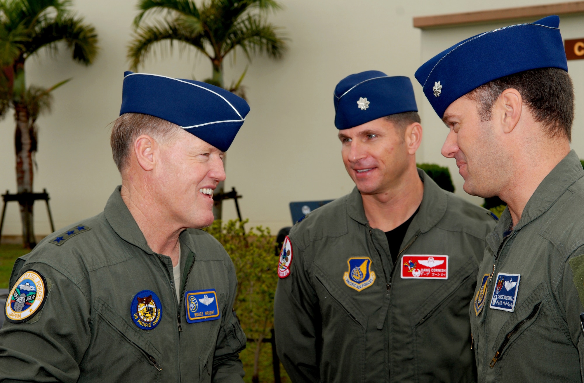 Lt. Col. Barry Cornish, 67th Fighter Squadron commander, and Lt. Col. Rick Boutwell, 44th Fighter Squadron commander, greet Lt. Gen. Bruce A. Wright during his visit to Kadena AB, Japan, Jan. 29. General Wright gave thanks to all the Airmen for their service and the importance of their mission. (U.S. Air Force photo/Chrissy FitzGerald)