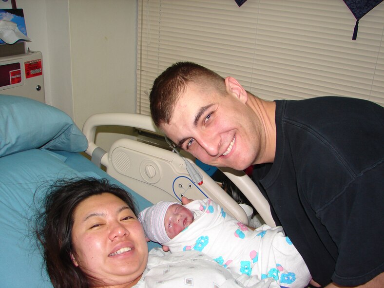 Staff Sgt. Bryan O’Sullivan, 18th Wing Safety Office and his wife, Megumi, welcome their son, Terence Issay O’Sullivan, into the world Jan. 13. Sergeant O’Sullivan was able to return from deployment and make it to the birth of his son by a mere 23 minutes.    (Courtesy photo)