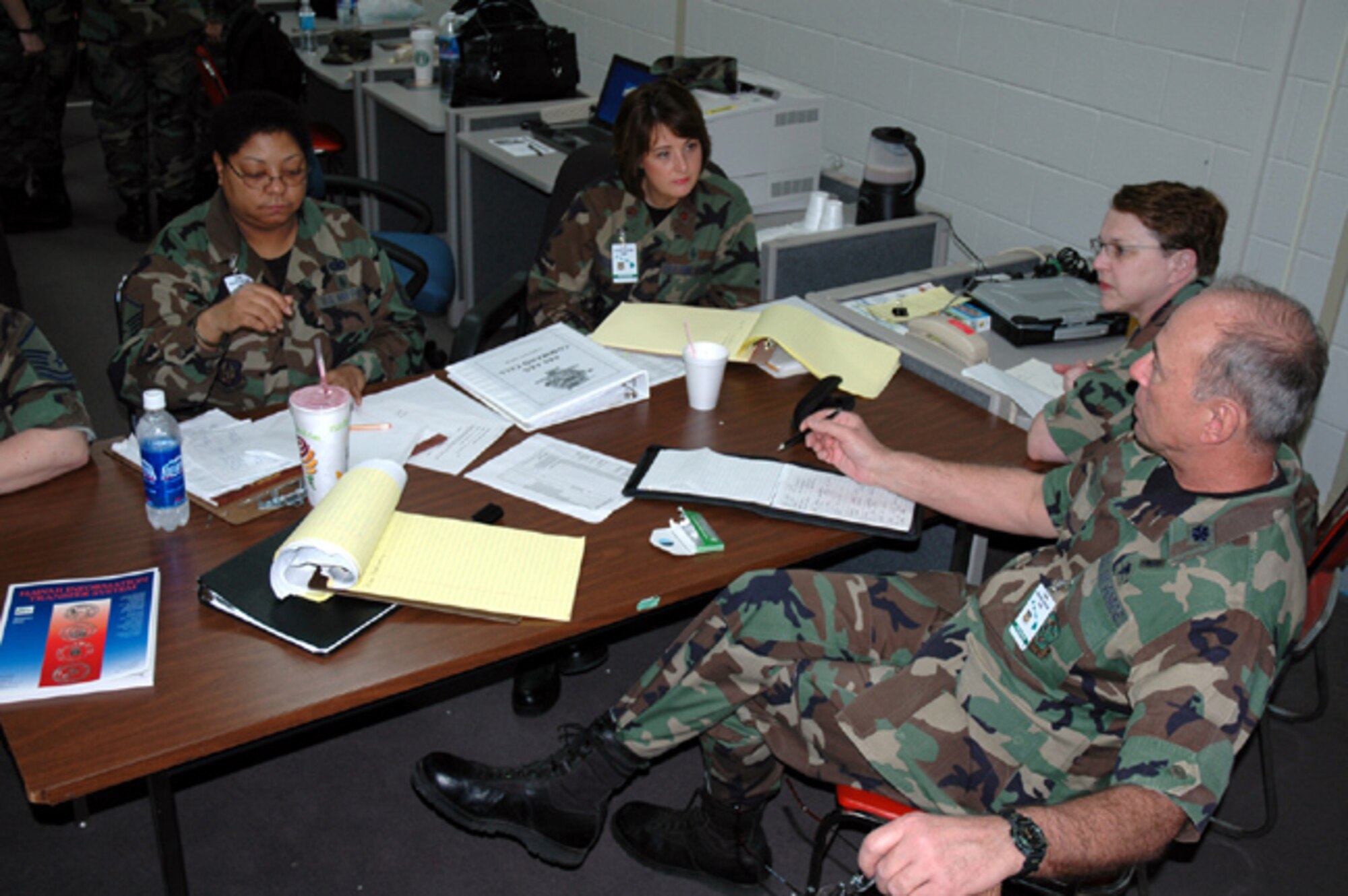 Master Sgt. Rita Herrington, Maj. Michelle Emerson , Lt. Col. Julia Scott, and Lt. Col. Pat Pound, 446th Aeromedical Evacuation Squadron, make up the Aeromedical Command Cell for the Pacific Lifeline exercise.  The command cell provides oversight for all aeromedical operations, the mobile aeromedical staging facility, the aeromedical liaison team, and the aeromedical operations team during the exercise.  Pacific Lifeline is a humanitarian assistance disaster response exercise taking place over three Hawaiian Islands Jan. 26 to Feb. 9.  More than 900 Department of Defense personnel are participating in the exercise. (U.S. Air Force photo/Capt. Jennifer Gerhardt)