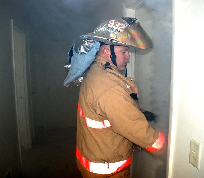 Where there is smoke, there is usually fire, except when the smoke is created by a simulation machine.  Recently Air Force Reserve Command firefighters from the 932nd Airlift Wing took turns entering a simulated burning structure to understand the challenges of not being able to see through smoke.  Interested in becoming a firefighter?  Call 1-800-257-1212 for more information on openings and training required.  Photo/Capt. Stan Paregien