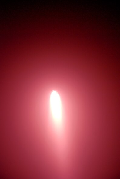 932nd Airlift Wing firefighters with flashlights practice to stay ready by working their way through a simulated burning building during a recent training exercise.  Call 1-800-257-1212 for more information on openings and training required to join these Air Force Reservist.  Photo/Capt. Stan Paregien