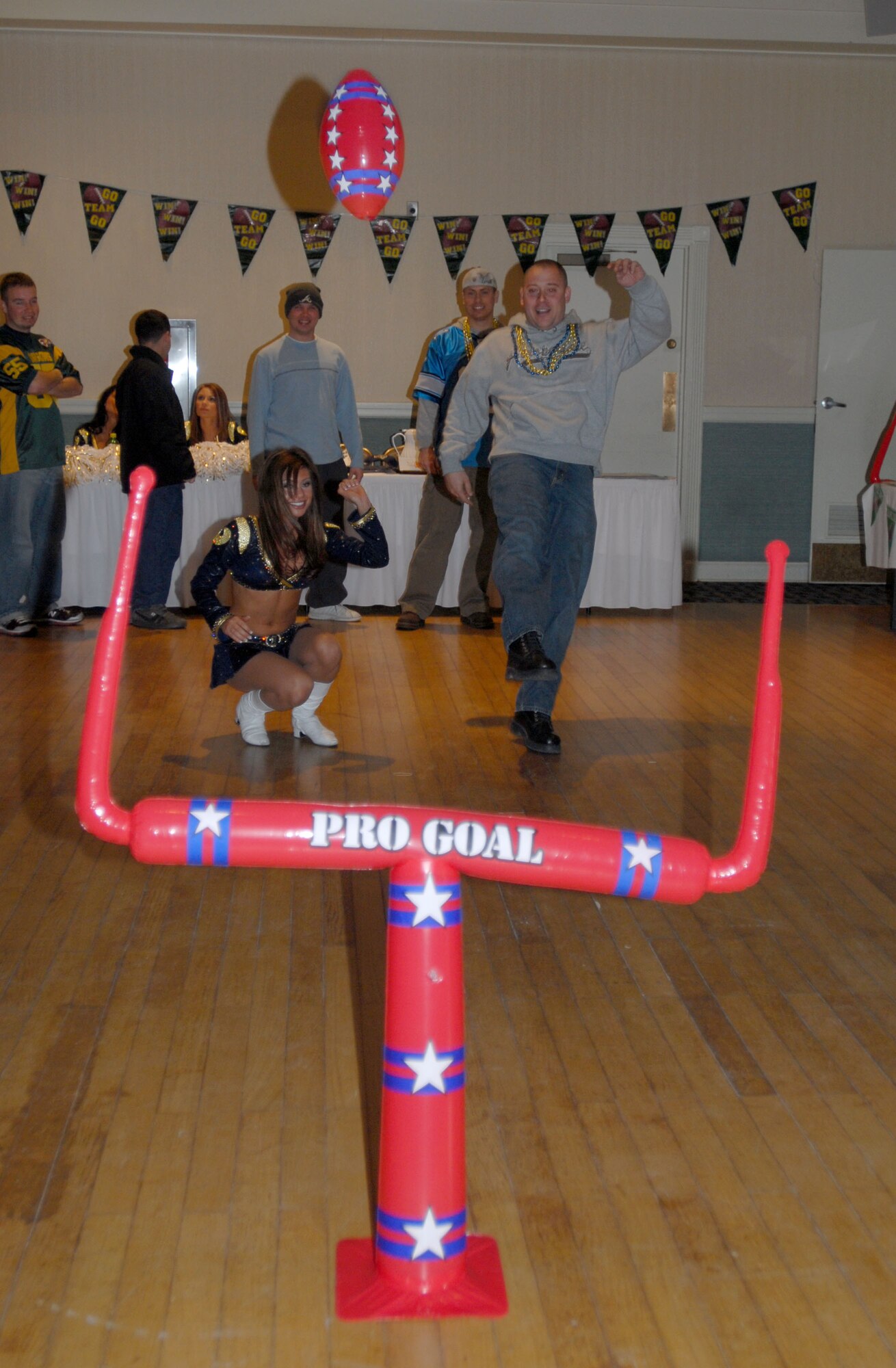 KUNSAN AIR BASE, South Korea -- Tech. Sgt. Jamie Hanson, from the 79th Expeditionary Fighter Squadron, deployed here from Shaw Air Force Base, SC kicks a field goal for a prize during the Super Bowl XLII Bash sponsored by the 8th Services Squadron here Feb. 4.  The 8th Services Squadron sponsors numerous events through out the year to boost Airmen morale and espirit de corp.  (U.S. Air Force photo/Staff Sgt. Darcie Ibidapo)