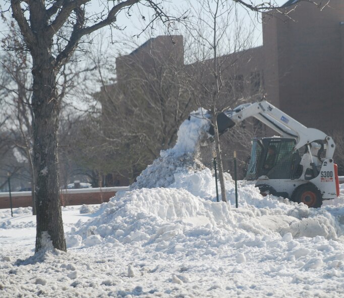 The first snowfall of 2008 brought out a snow removal machine across the street from the temporary location of the 932nd Airlift Wing.  The wing hopes to move back to the renovated building in the fall of 2008.