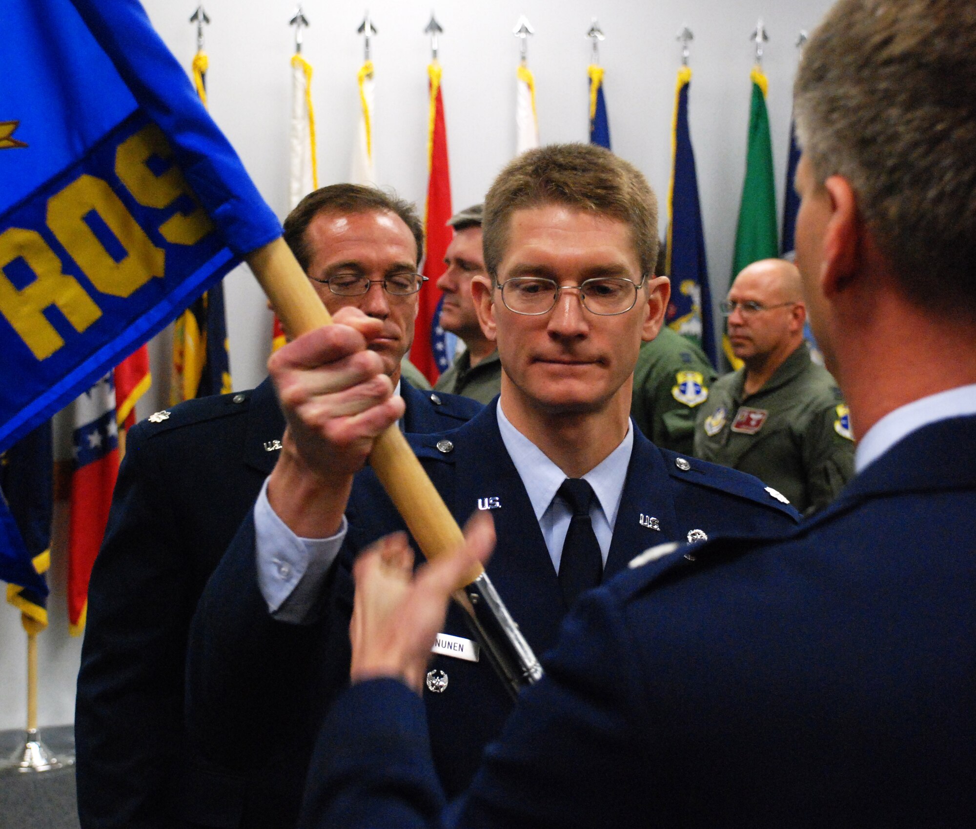 PATRICK AIR FORCE BASE, Fla. -- A former rescue-helicopter pilot took command of the 920th Rescue Wing's pararescue squadron during a change-of-command ceremony held at the professional development center here today. Lt. Col. Joel Kinnunen, seen here accepting the pararescue squadron guidon, succeeded Lt. Col. Coy Speer, who is retiring after 20 years of service to teach science at a high school in Arizona. Colonel Kinunnen comes to Patrick from one of the wing's geographically-separated units at Portland, Ore. Air Force pararescue men provide combat search and rescue support for special operations units and pilots shot down behind enemy lines, search and rescue service for civilian mariners, humanitarian relief during natural disasters and provide emergency medical support for every NASA shuttle and rocket launch. (U.S. Air Force photo/Staff Sgt. Paul Flipse)
