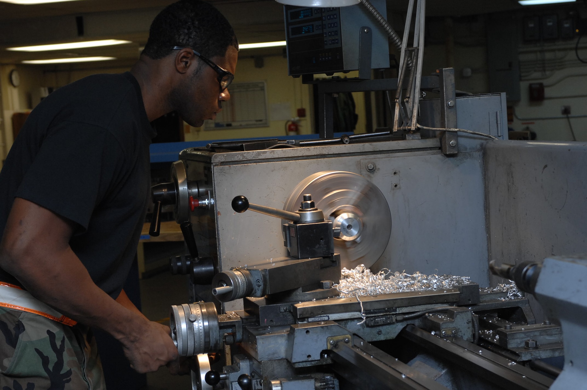 MOUNTAIN HOME AIR FORCE BASE, Idaho-- Senior Airman Brandon Wilson, 366th Equipment Maintenance Squadron aircraft metal technician, fabricates a piece of aluminum stock to replace an aircraft part during Phase I of Exercise Sharpshooter 08-03 here, Feb. 1. Units across the base are participating in the exercise to prepare personnel and equipment for the upcoming March 2008 Operational Readiness Inspection. (U.S. Air Force photo/ Staff Sgt. Kathy Parker)