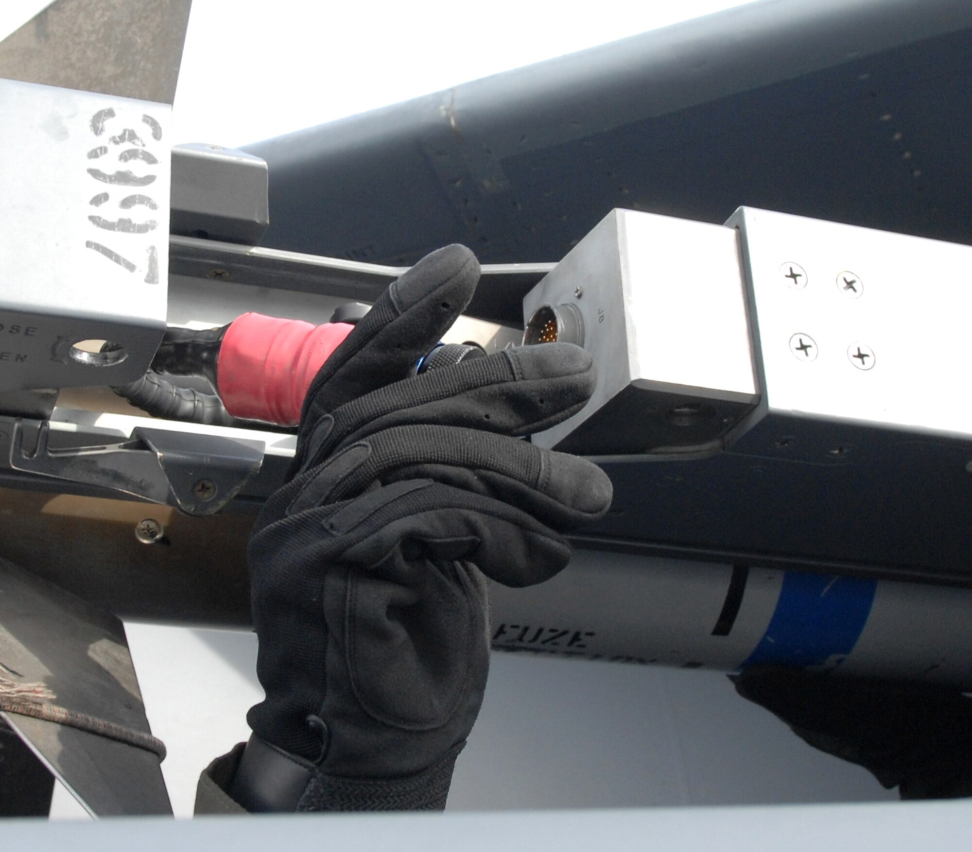MOUNTAIN HOME AIR FORCE BASE, Idaho-- Airman 1st Class Craig Petersen, 389th Aircraft Maintenance Unit load crew team member, loads an Aim-9 Sidewinder missile onto an F-15E Strike Eagle here Feb. 1 during the Phase I portion of Exercise Sharpshooter 08-03.  Units across the base are participating in the exercise to prepare personnel and equipment for the upcoming March 2008 Operational Readiness Inspection. (U.S. Air Force photo/Airman 1st Class Stephany Miller)