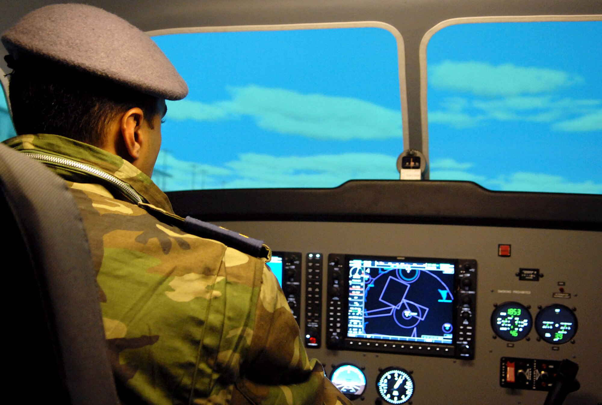 An Iraqi pilot takes control of a Cessna simulator at the Iraqi Flying Training School here. Iraqi pilots have begun flying their own missions and have earned some initial successes. An all-Iraqi crew flying on a recent reconnaissance mission spotted several terrorists manufacturing improvised explosive devices. The crewmember’s alerted Iraqi Police who arrived on-scene soon after to impede the terrorist’s efforts. (U.S. Air Force photo by Senior Airman SerMae Lampkin)