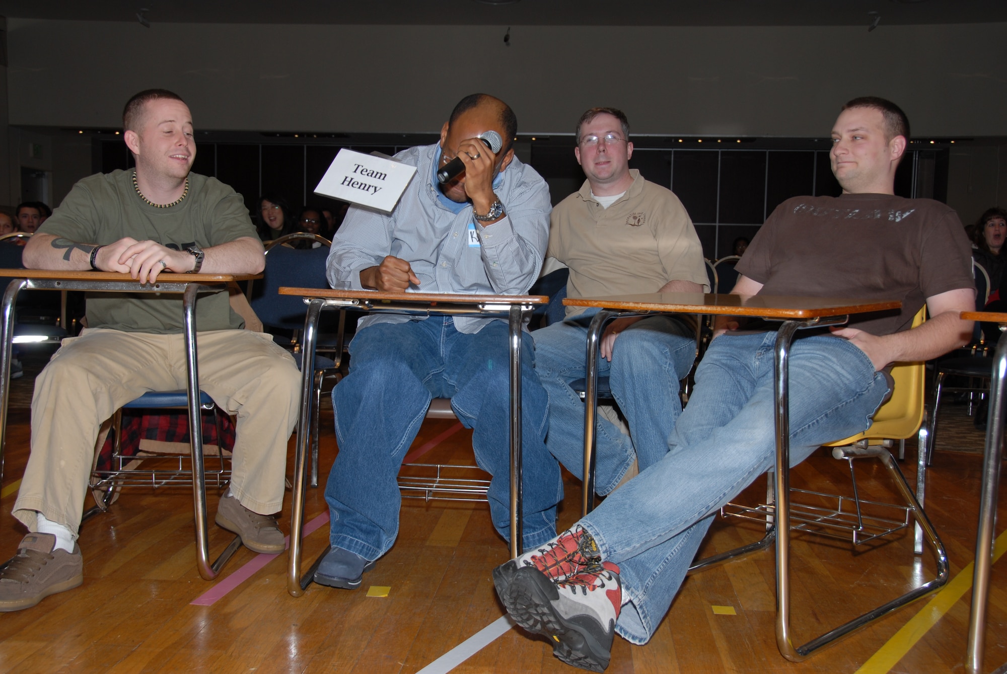 MISAWA AIR BASE, Japan -- From left to right, Michael Little, Karl Henry, Brian Watson and Michael McDonald, Team Henry members, react to giving the wrong answer in the finals of the "Are You Smarter Than A 5th Grader" competition at the Mokuteki Community Center Jan. 19, 2008. Team Henry came in second place, earning $300. (U.S. Air Force photo by Staff Sgt. Rachel Martinez) 