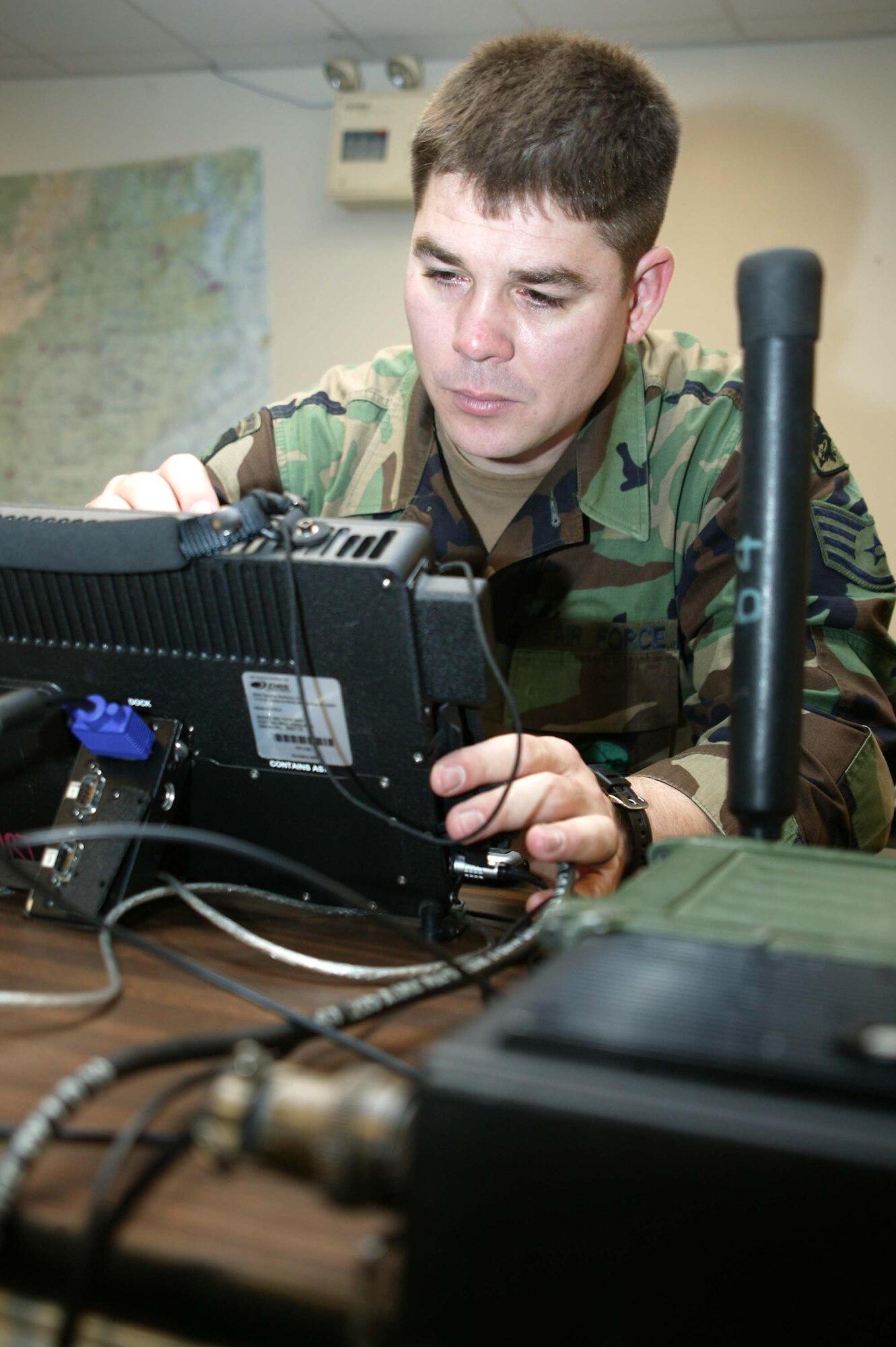 SHAW AIR FORCE BASE, S.C. -- Staff Sgt. Ryan Fausey, 682nd Air Support Operations Squadron fighter duty technician, requests a status report from joint terminal attack controllers on the military ruggidized toughbook Feb. 1. Sergeant Fausey is Air Force's 2007 Fighter Duty Technician of the Year. (U.S. Air Force photo/Staff Sgt. John Gordinier)
