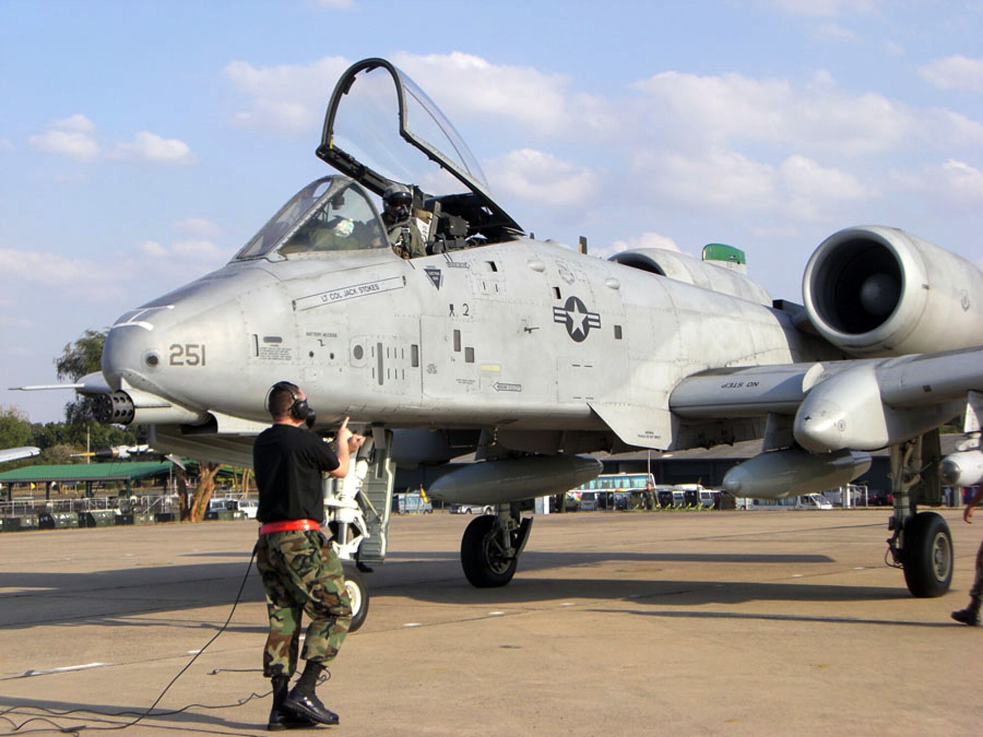 A maintainer marshalls an A-10 Thunderbolt II after landing at the Korat Royal Thai Air Base, Thailand, from Osan Air Base, South Korea. Six A-10s from the 25th Fighter Squadron at Osan AB are in Thailand to participate in Exercise Cope Tiger 2008, a multilateral joint and combined field training and humanitarian and civic assistance exercise involving Thailand, Singapore and the United States. (U.S. Air Force photo/Capt. Renee Lee) 