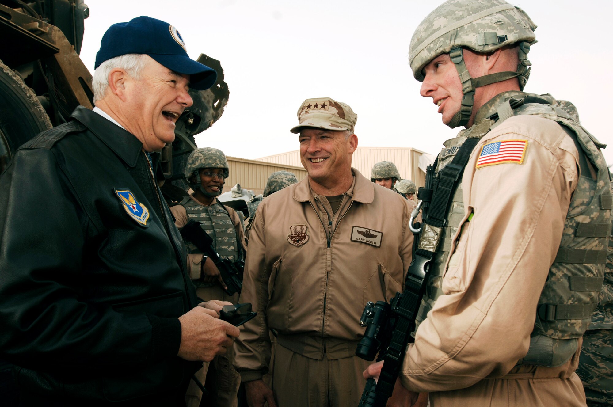 Secretary of the Air Force Michael Wynne (left), Lt. Gen. Gary North (center), U.S. Central Command Air Forces commander, talk with Tech. Sgt. Douglas Schmidt during a damaged M915 semi-tractor trailer display during the SECAFs visit Feb. 1. The SECAF spoke with more than 400 Airmen during his visit and gained greater insight on the 6,800 plus Airmen deployed throughout Southwest Asia in non-traditional Air Force functions. Sergeant Schmidt is a convoy commander from the 586th Expeditionary Logistics Readiness Squadron, 424th Medium Truck Detachment. (U.S. Air Force photo/Senior Airman Patrick Dixon) 