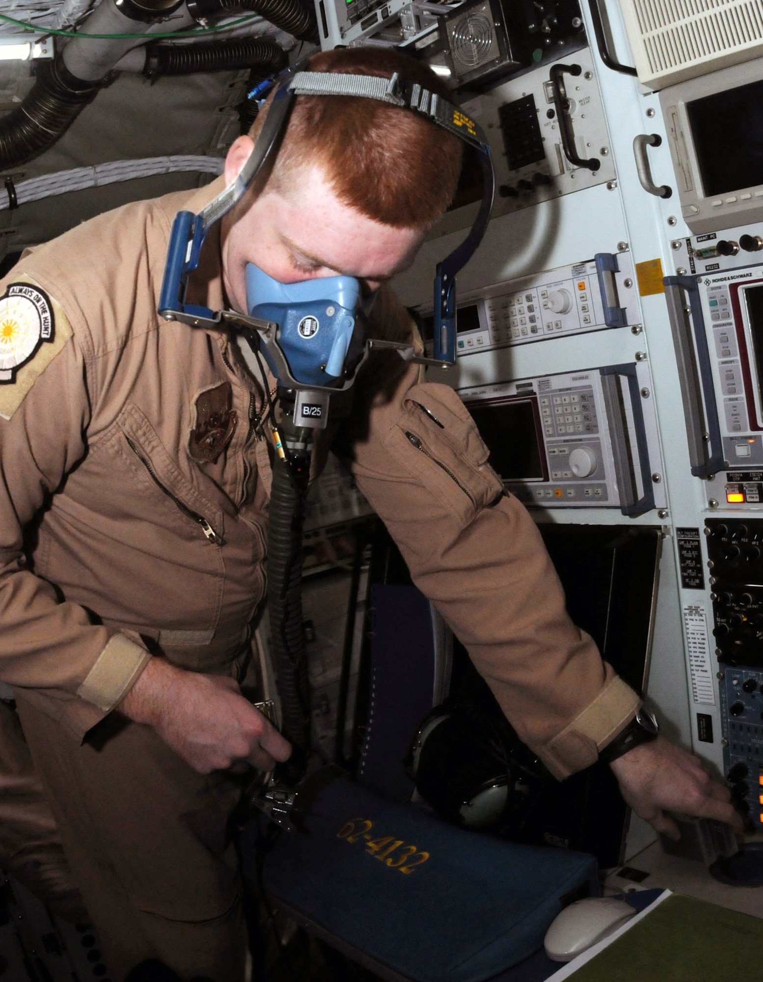 Staff Sgt. William Bryan checks the oxygen flow inside a  mask aboard a RC-135 Rivet Joint aircraft Jan. 30 in Southwest Asia. Cockpit crews, intelligence experts, electronic warfare officers, and in-flight maintenance technicians have rotated into and out of Southwest Asia along with the aircraft for a variety of duties over the past 17 years. Sergeant Bryan is an airborne systems engineer with the 763rd Expeditionary Reconnaissance Squadron and is deployed from Offutt Air Force Base, Neb. (U.S. Air Force photo/Senior Airman Domonique Simmons)