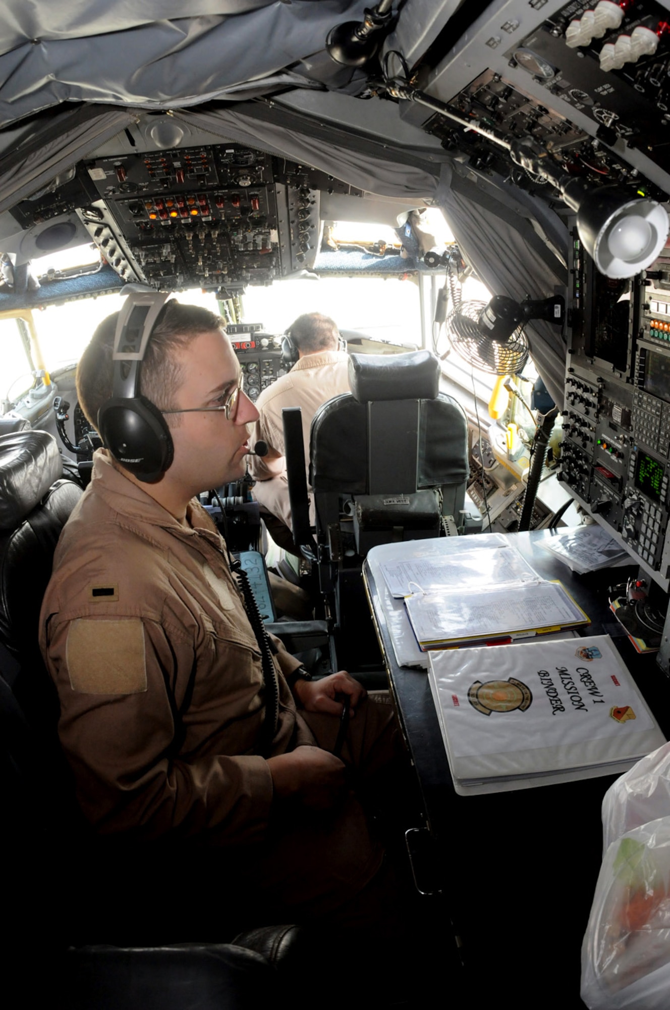 Navigator 1st Lt. Eric Myatt performs a cross-check inside a RC-135 Rivet Joint aircraft in preparation for take off Jan. 30. Based out of Southwest Asia, the RC-135 has maintained a presence in the Central Command area of responsibility since August 1990. The lieutenant is with the 763rd Expeditionary Reconnaissance Squadron.  (U.S. Air Force photo/Senior Airman Domonique Simmons)