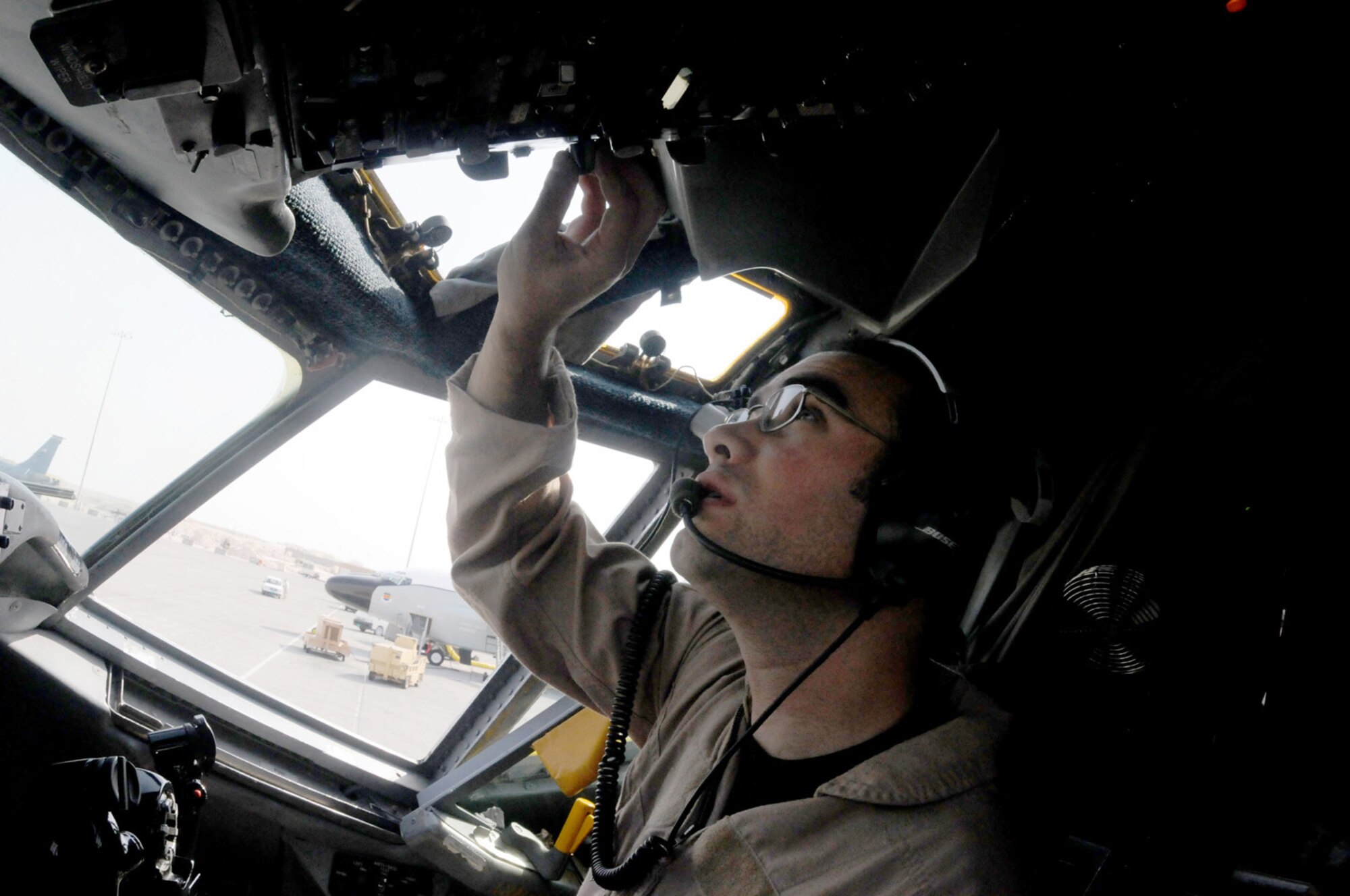 The RC-135 Rivet Joint aircraft co-pilot, 1st Lt. Jonathan George, tests equipment in preparation for take off Jan. 30 from a location is Southwest Asia. The lieutenant is a member of the 763rd Expeditionary Reconnaissance Squadron.(U.S. Air Force photo/Senior Airman Domonique Simmons)