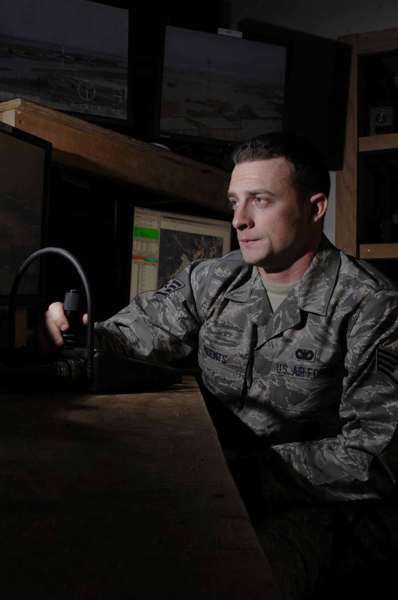 BAGRAM AIR BASE, Afghanistan - Staff Sgt. Lawrence Reents, 455th Expeditionary Security Forces Squadron, uses a remote control to watch the perimeter here Feb 3. Reents was recently selected as the Warrior of the Week. His home unit is the 88th Security Forces Squadron, Wright Patterson, Ohio, where he is an installation patrolman. (U.S. Air Force photo by Master Sgt. Demetrius Lester)