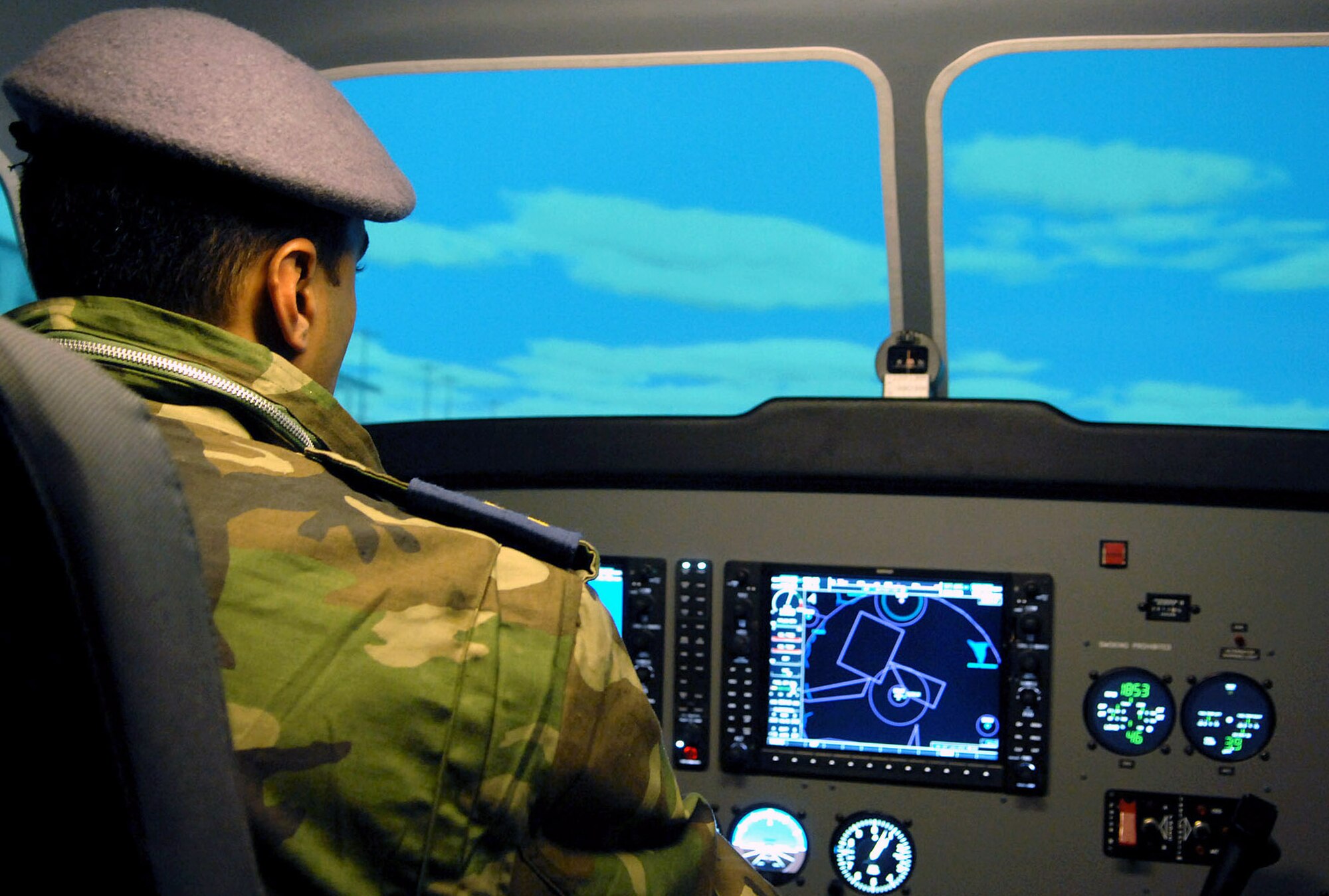 An Iraqi lieutenant takes controls of a Cessna simulator at the Iraqi Flying Training School here. Iraqi pilots have begun flying their own missions and have earned some initial successes. An all-Iraqi crew flying on a recent reconnaissance mission spotted several terrorists manufacturing improvised explosive devices. The crewmembers alerted Iraqi police who arrived on-scene soon after to impede the terrorist?s efforts. (U.S. Air Force photo/Senior Airman SerMae Lampkin)