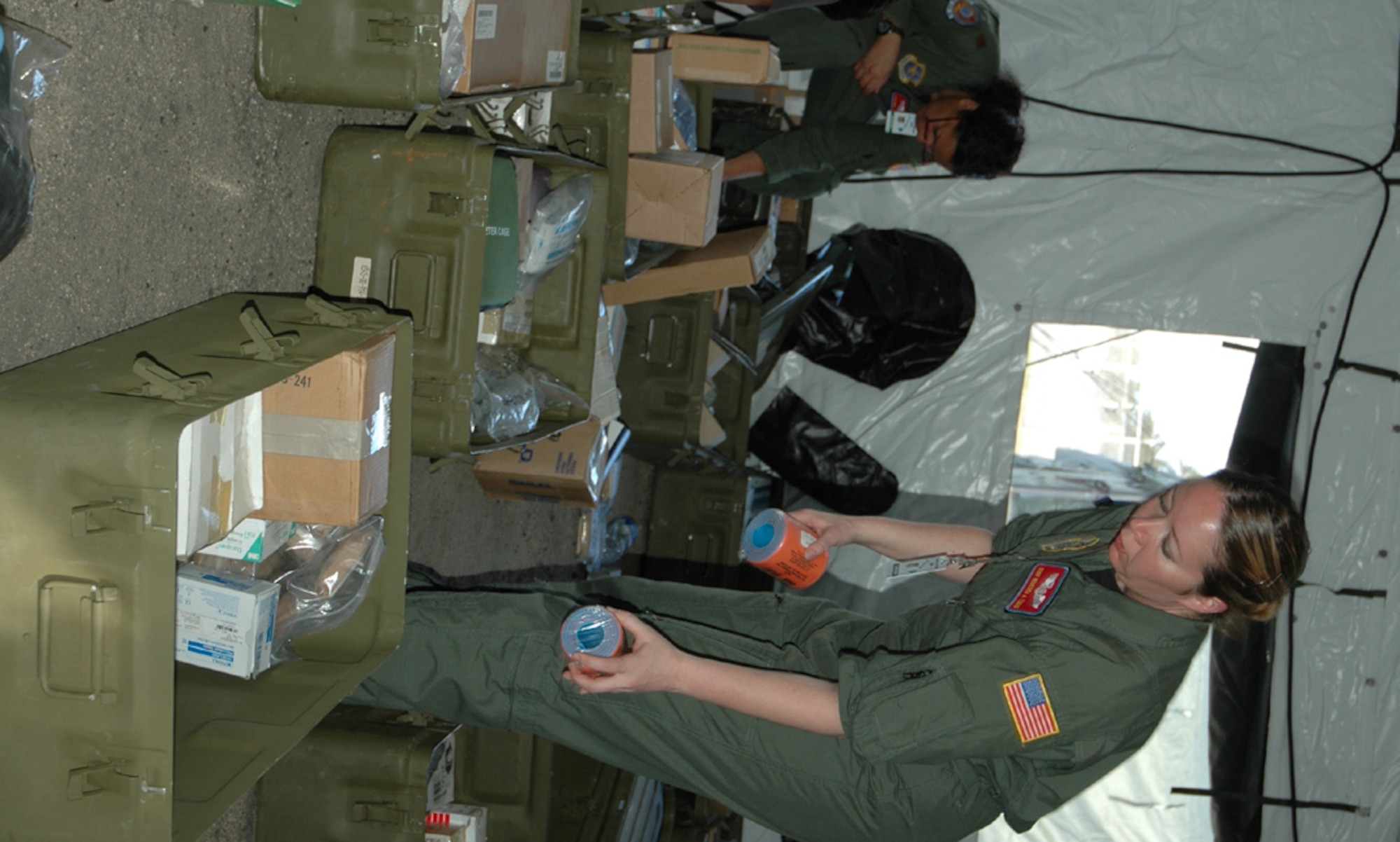 Maj. Jackie Jackson and Senior Airman Rebecca Timms, inventory medical supplies Jan. 30 to use in the Mobile Aeromedical Staging Facility during the Pacific Lifeline exercise. Pacific Lifeline is a humanitarian assistance disaster response exercise taking place on three Hawaiian Islands Jan. 26 to Feb. 9. More than 900 Department of Defense personnel are participating. Major Jackson is a flight nurse and Airman Timms is a flight medic, both are with the 375th Aeromedical Evacuation Squadron at McChord Air Force Base, Wash. (U.S. Air Force photo/Capt. Jennifer Gerhardt)