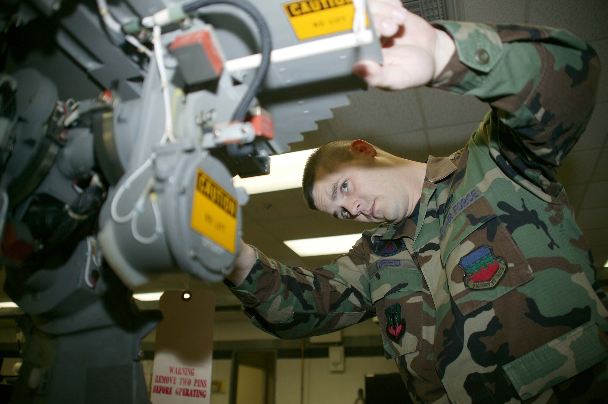 SHAW AIR FORCE BASE, S.C. -- Tech. Sgt. Robert Reed, 20th Component Maintenance Squadron avionics section assistance chief, inspects a radar antenna in the avionics workshop Jan. 22. Sergeant Reed earned the Sumter's Chamber of Commerce Military Citizen of the Year Award for his community involvement and volunteer activities. (U.S. Air Force photo/Staff Sgt. John Gordinier)