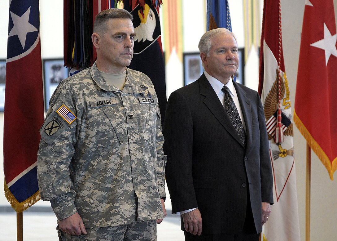 Defense Secretary Robert M. Gates stands with  Army Col. Mark Milley, deputy commander of operations for the 101st Airborne Division Air Assault, during his promotion ceremony to brigadier general on Fort Campbell, Ky., Feb. 1, 2008. 