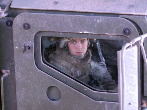 Cpl. Richard J. Nelson sits inside of a 7-ton truck preparing for a mission in Iraq. Nelson was killed by a roadside bomb Apr. 14 in the al Anbar province of Iraq. He will be remembered by friends and family as a funny, loving and life of the party type of person.