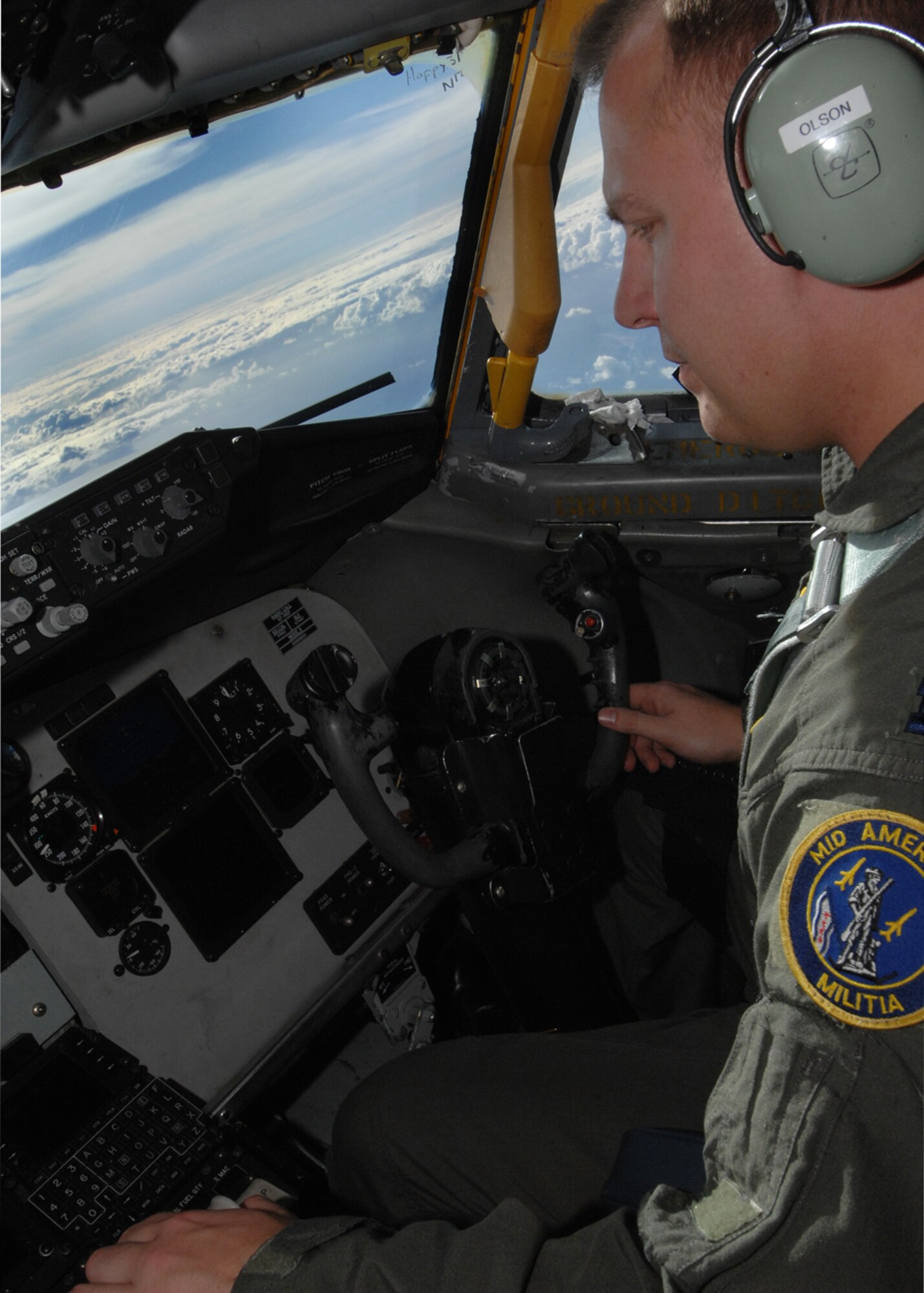 ANDERSEN AIR FORCE BASE, Guam-- Captain Steve Olsen, 126th Air Refueling Wing, Scott Air Force Base, Il.  flys a KC-135 over the Philippine Sea during a routine refueling mission for the 393rd Expeditionary Bomb Squadron B-2 Spirit bombers from Whiteman AFB, Mo.  The KC-135’s ability to refuel planes mid-air helps accomplish The Air Force's primary missions of Global Reach and Global Power. (U.S. Air Force Photo by Staff Sergeant Vanessa Valentine)