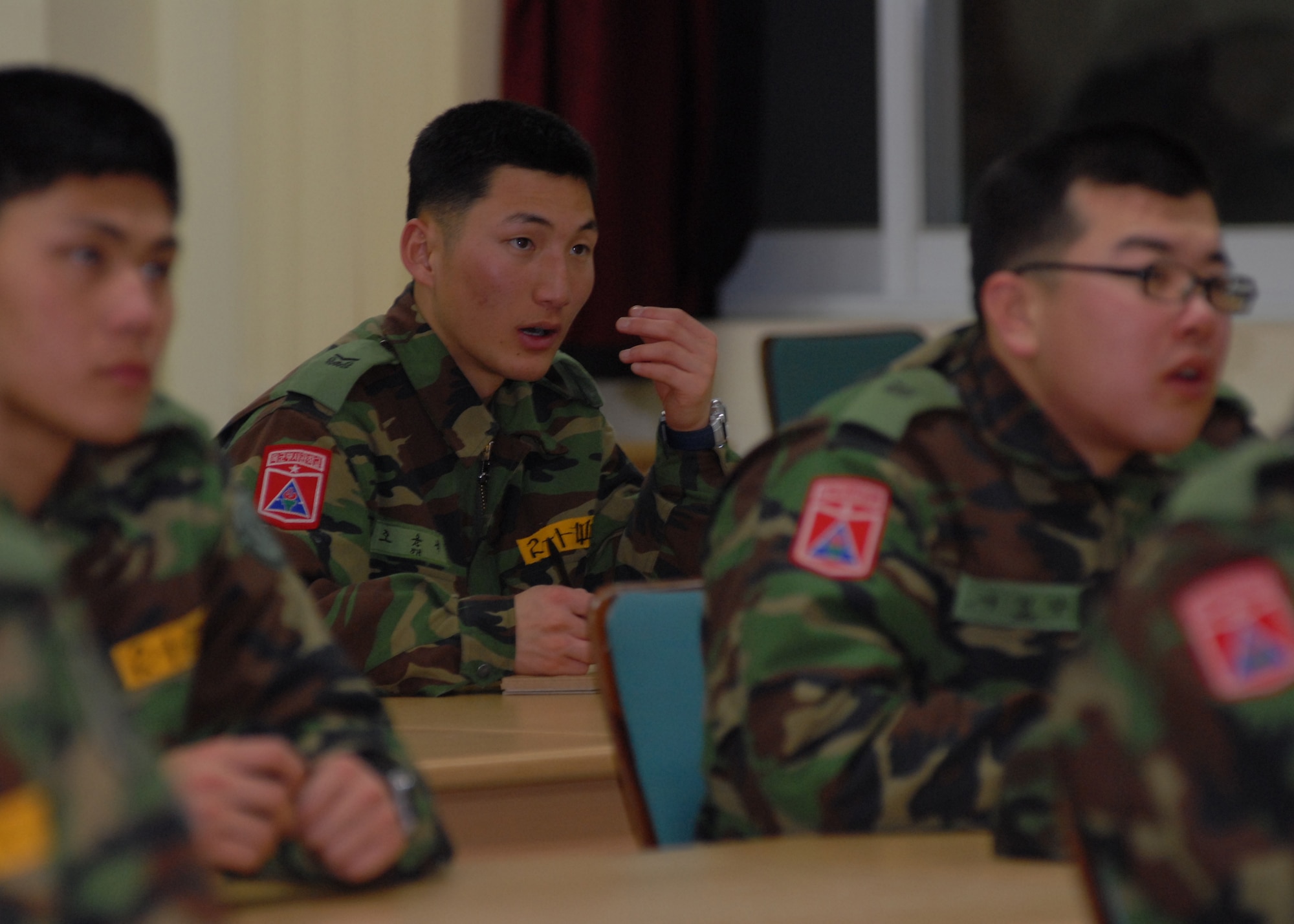 KUNSAN AIR BASE, South Korea -- Republic of Korea Army Non-commissioned Officer Academy students repeat phrases after their instructor here 31 Jan. Numerous Airmen from the 5/6 group take the opportunity throughout the year to assist ROK Cadets in learning English as part of the academy’s curriculum. (U.S. Air Force Photo/Staff Sgt Araceli Alarcon)