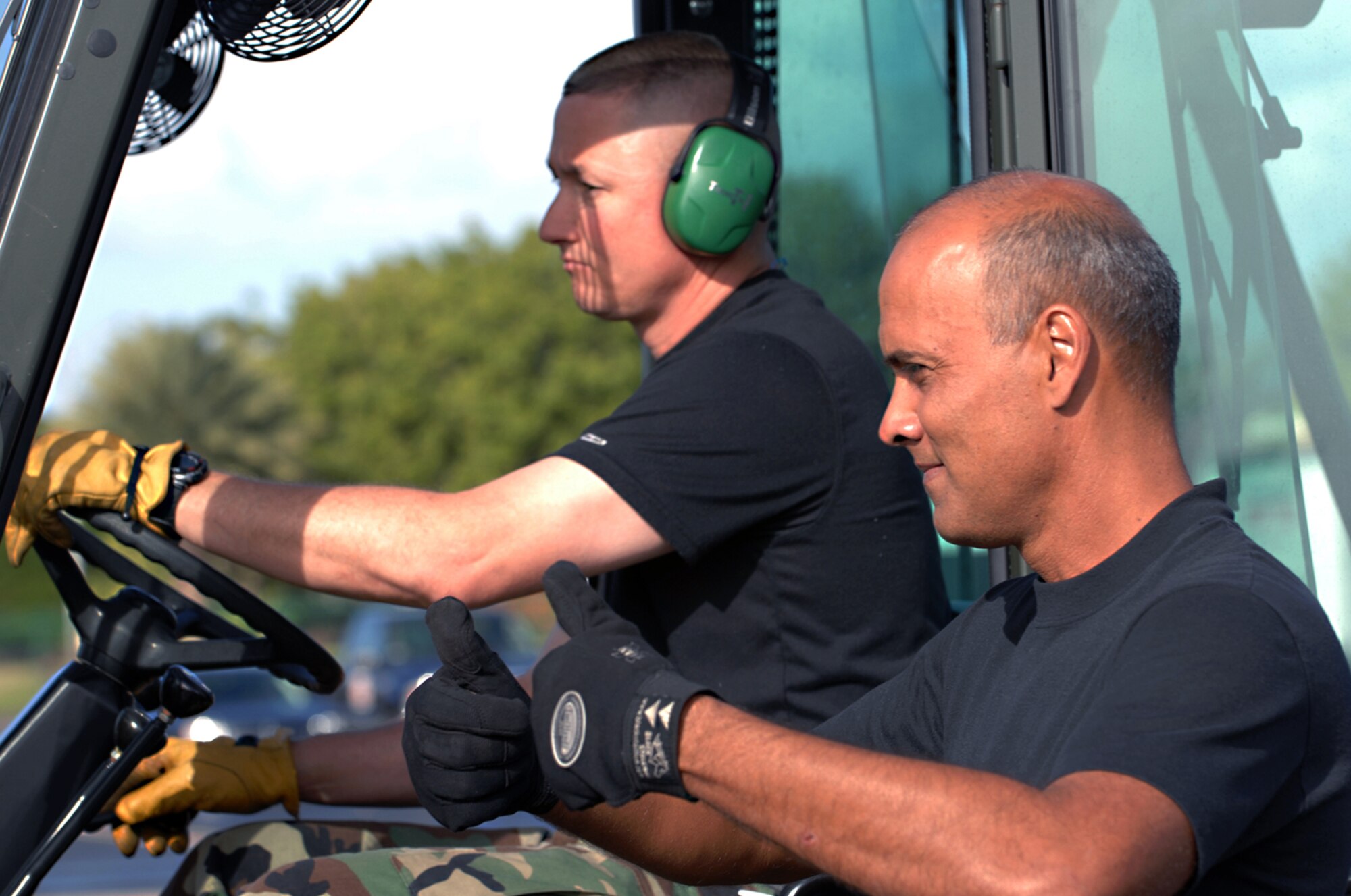 Tech. Sgt. Jay Perez guides Staff Sgt. Joe Pruitt Jan. 29 as he loads a pallet container of Meal Ready to Eat packages at Hickam Air Force Base, Hawaii. Sergeant Perez is part of the 44th Aerial Port Squadron at Andersen AFB, Guam, and Sergeant Pruitt is a reservist with the 73rd APS based out of the Naval Air Station Joint Reserve Base in Carswell, Texas. Pacific Lifeline is a total force exercise designed to practice the military's ability to rapidly deploy a trained, equipped team anywhere in the Pacific in response to a humanitarian assistance or disaster scenario. (U.S. Air Force photo/Airman 1st Class Jimmy L. Dang) 