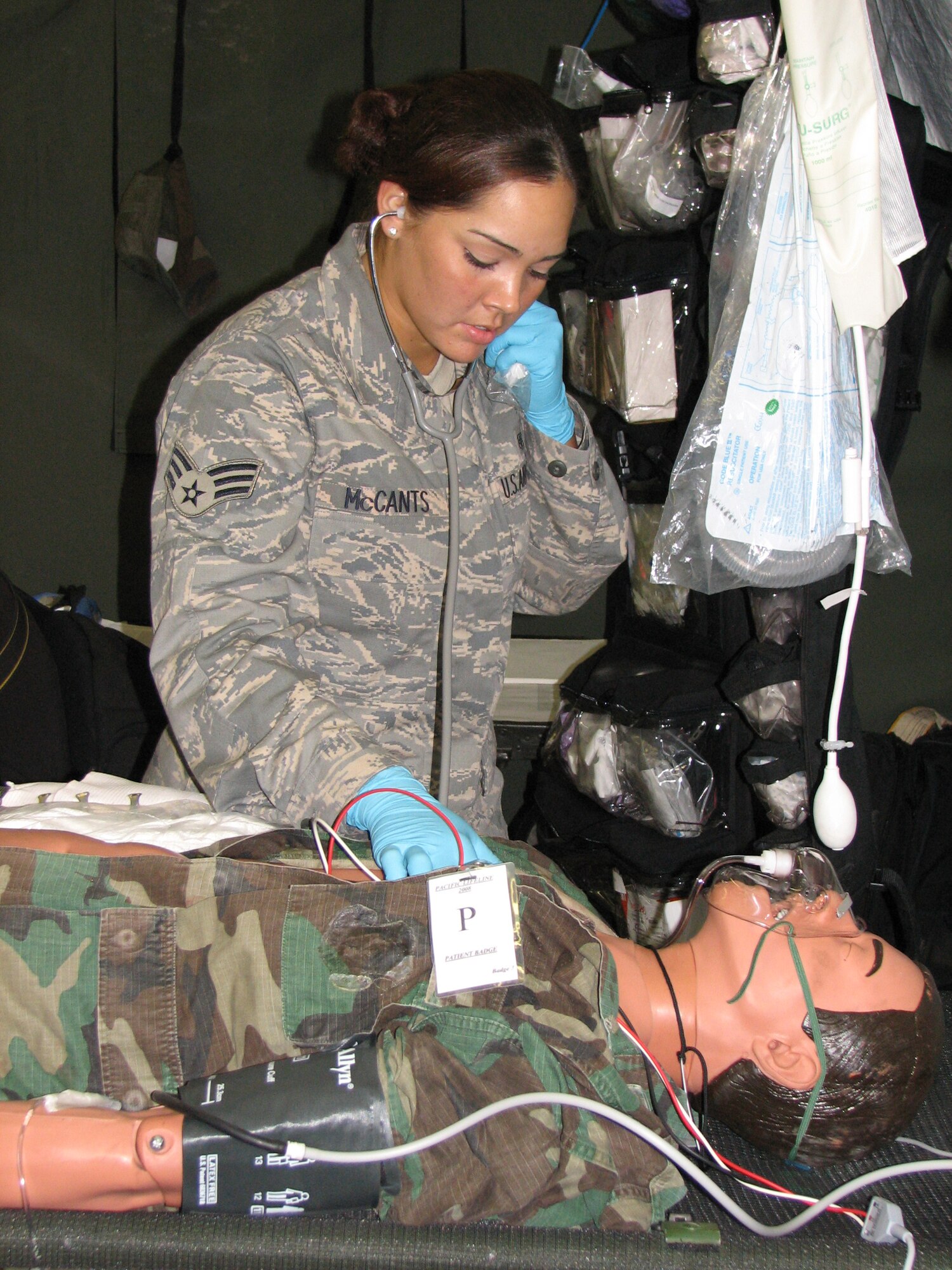 KONA, Hawaii - Senior Airman Nicole McCants, a respiratory therapy specialist from the 3rd Medical Group, Elmendorf Air Force Base, Alaska, checks the vital signs of a patient during a mass casualty exercise at the Kona International Airport, Kona, Hawaii, Feb. 4.  Airman McCants is one of more than 900 Department of Defense personnel participating in Pacific Lifeline, a total force humanitarian assistance and disaster relief exercise taking place from three locations within the Hawaiian Islands through Feb. 9. Led by 13th Air Force, Pacific Lifeline provides an integrated team of Air Force and Army active-duty, Air National Guard and Reserve Component forces a training environment to test their abilities to respond to and support humanitarian and natural disaster relief operations within the Pacific Region. (U.S. Air Force photo by Senior Master Sgt. Charles Ramey)