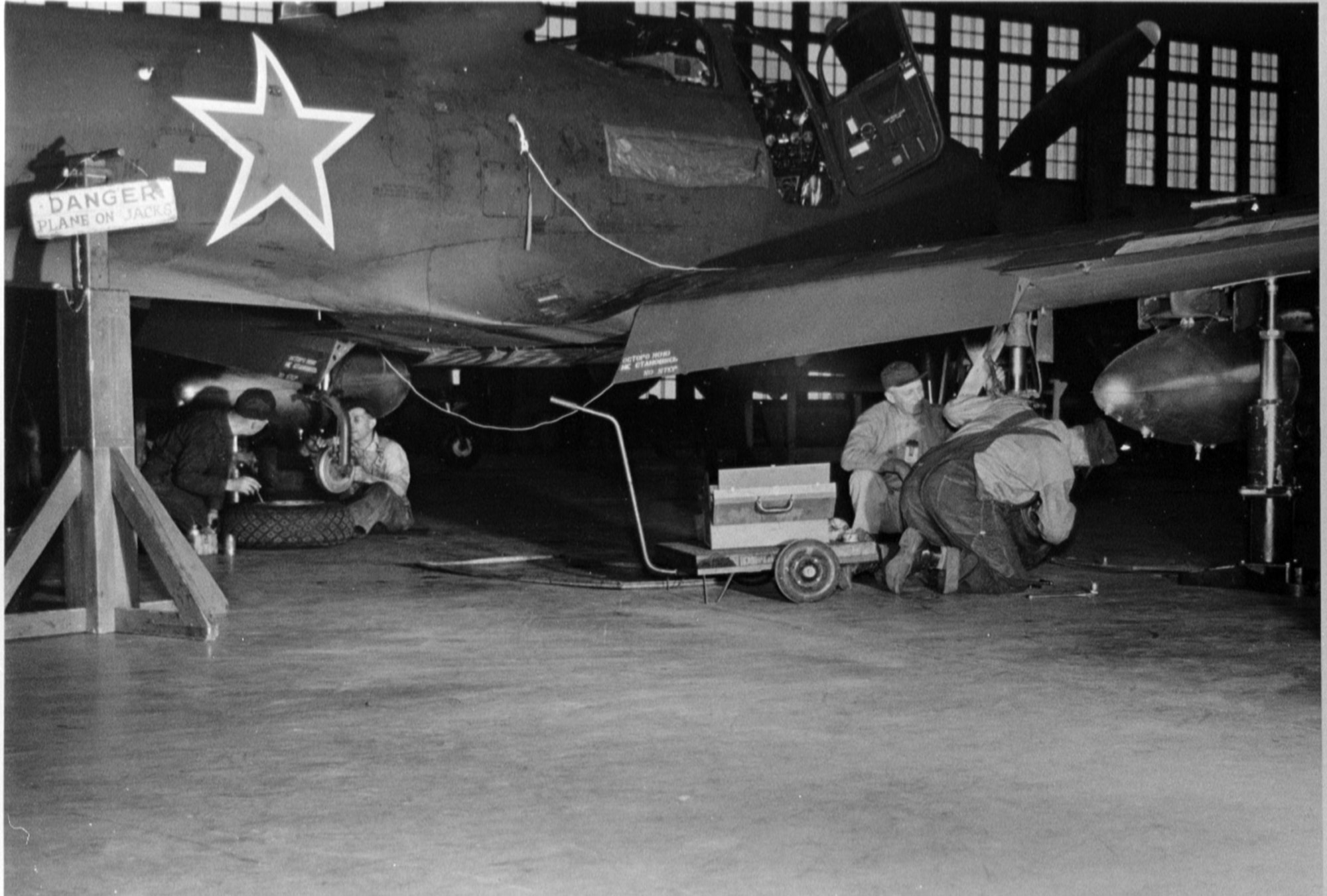 A processed P-63 Kingcobra undergoes a tire and brake inspection in the final processing hanger at Great Falls Army Air Base June 1945 during the Lend-Lease Program. (photo courtesy of the Malmstrom Museum)