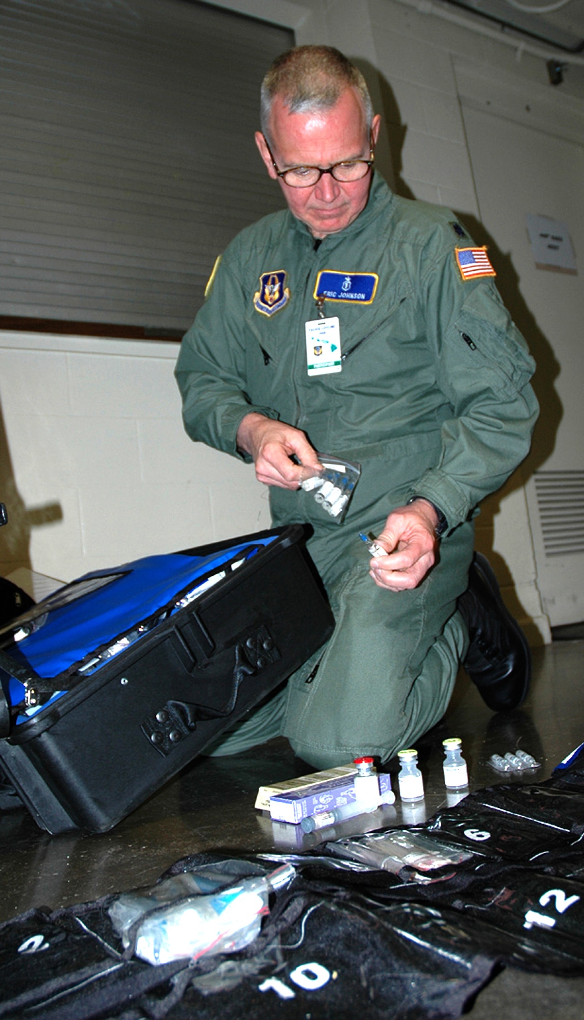 Lt. Col. (Dr.) Eric Johnson, an anesthesiologist with the 446th Aeromedical Staging Squadron, McChord Air Force Base, Wash.,  inventories the drug kit to make sure the Critical Care Air Transport team has every medicine it will need during flights for the Pacific Lifeline exercise.  Pacific Lifeline is a humanitarian assistance disaster response exercise taking place over three Hawaiian Islands Jan. 26 to Feb. 9.  More than 900 Department of Defense personnel are participating, including 145 Reservists from the 446th Airlift Wing at McChord. (U.S. Air Force photo/Capt. Jennifer Gerhardt)