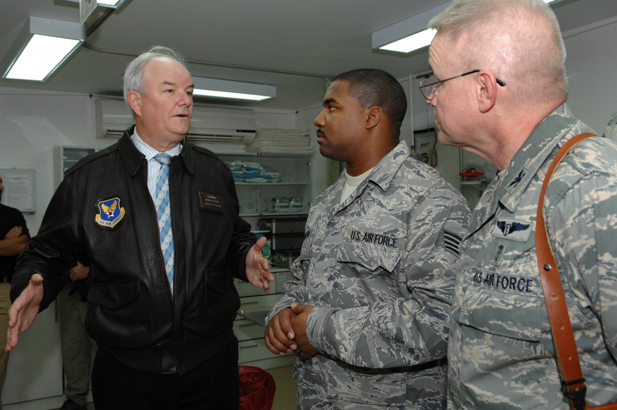 Secretary of the Air Force Michael Wynne talks with Staff Sgt. Andre Rouzan, 332nd Expeditionary Medical Group technician, about the medical miracles that have taken place at the Air Force Theater Hospital here, Feb. 2. The hospital serves as the primary medical treatment facility for wounded servicemembers in Iraq. Sergeant Rouzan is deployed from Lackland Air Force Base, Texas. (U.S. Air Force photo/Senior Airman Julianne Showalter)