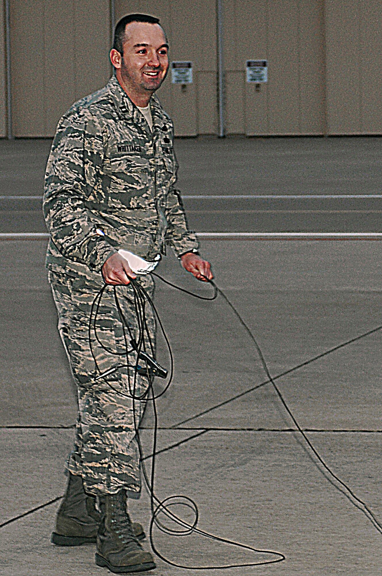 CANNON AIR FORCE BASE, N.M. -- Capt Jonathan Whittaker disconnects the bonding and grounding cables during the final fueling of F-16s here on Jan. 30. Captain Whittaker fueled the first F-16s here in 1995 as an Airman as well as the last F-16s before they headed to Spandahlem Air Base, Germany. (Air Force photo by Airman 1st Class James Bell)
