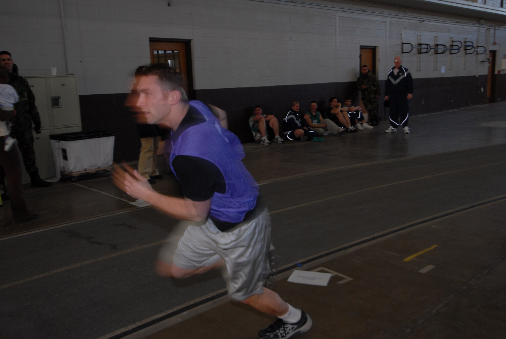 Airman 1st Class Steven Swifford, Air Force Financial Services, rushes to the finish line during the Iron Flight competition, Jan. 31.   Four squadrons participated in the event; Communications, Logistics Readiness, Services, and the Air Force Financial Services Center.  (U.S. Air Force photo/Airman 1st Class Abigail Klein)