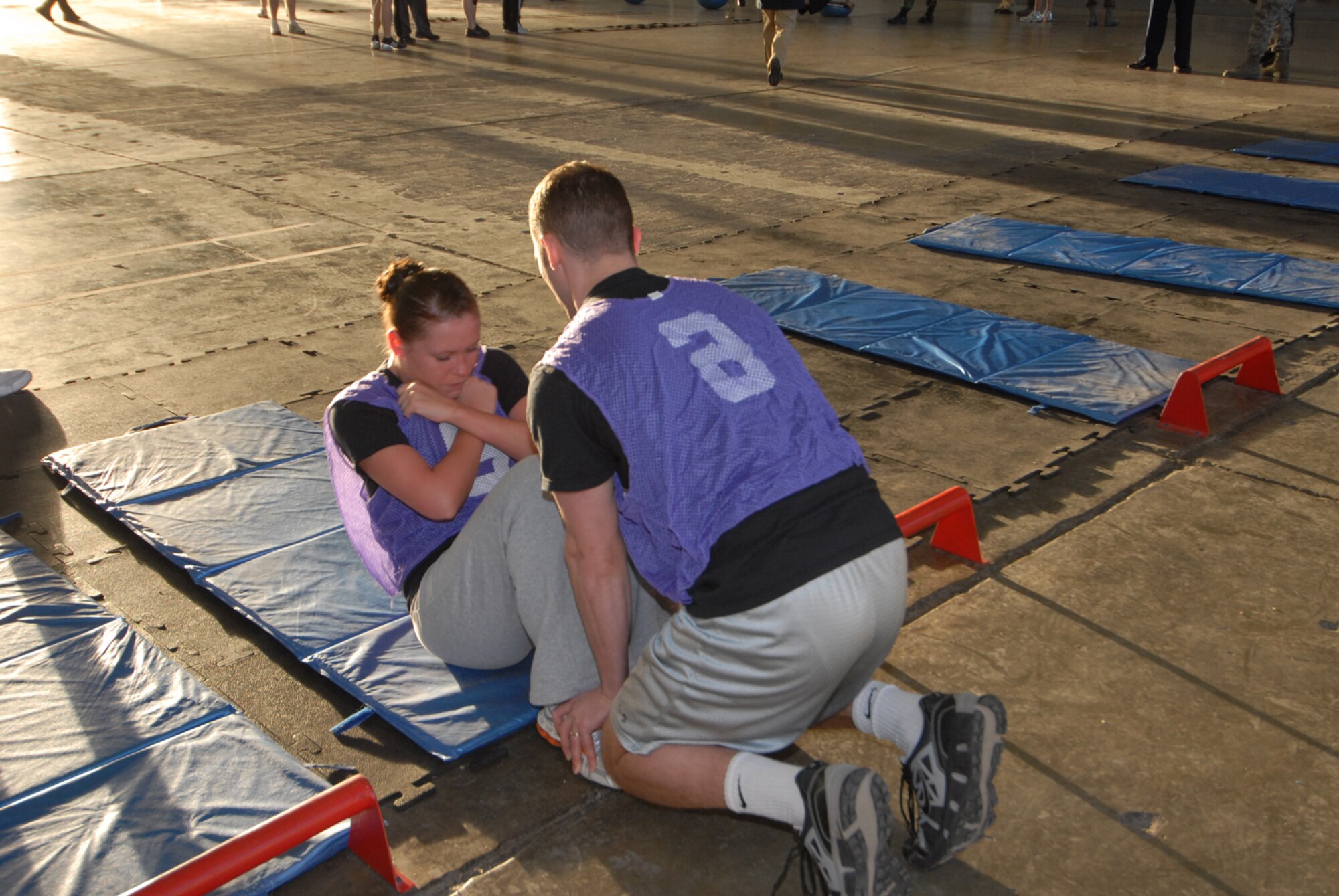 Senior Airman Arianna Moore, Air Force Financial Services Center, performs sit-ups during the Iron Flight competition, Jan. 31.   Four squadrons participated in the event; Communications, Logistics Readiness, Services, and the Air Force Financial Services Center.  (U.S. Air Force photo/Airman 1st Class Abigail Klein)