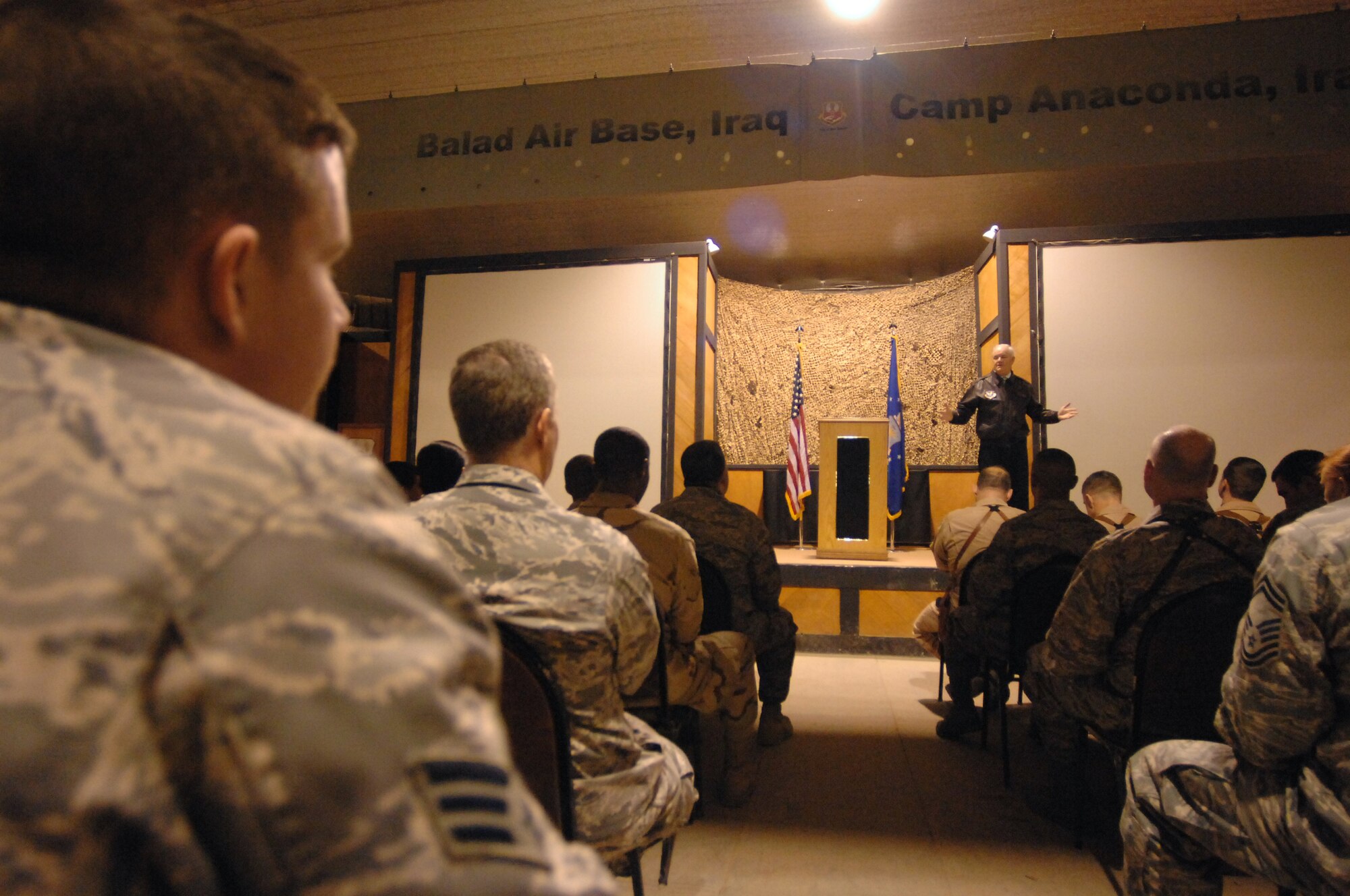 BALAD AIR BASE, Iraq -- Secretary of the Air Force Michael Wynne speaks to Balad Airmen about the importance of their service here, Feb. 2. Secretary Wynne answered questions during an Airmen's Call on the topics of in-lieu-of taskings, the future of airpower, as well as the current and future changes on the horizon for basic training. (U.S. Air Force photo/ Senior Airman Julianne Showalter)