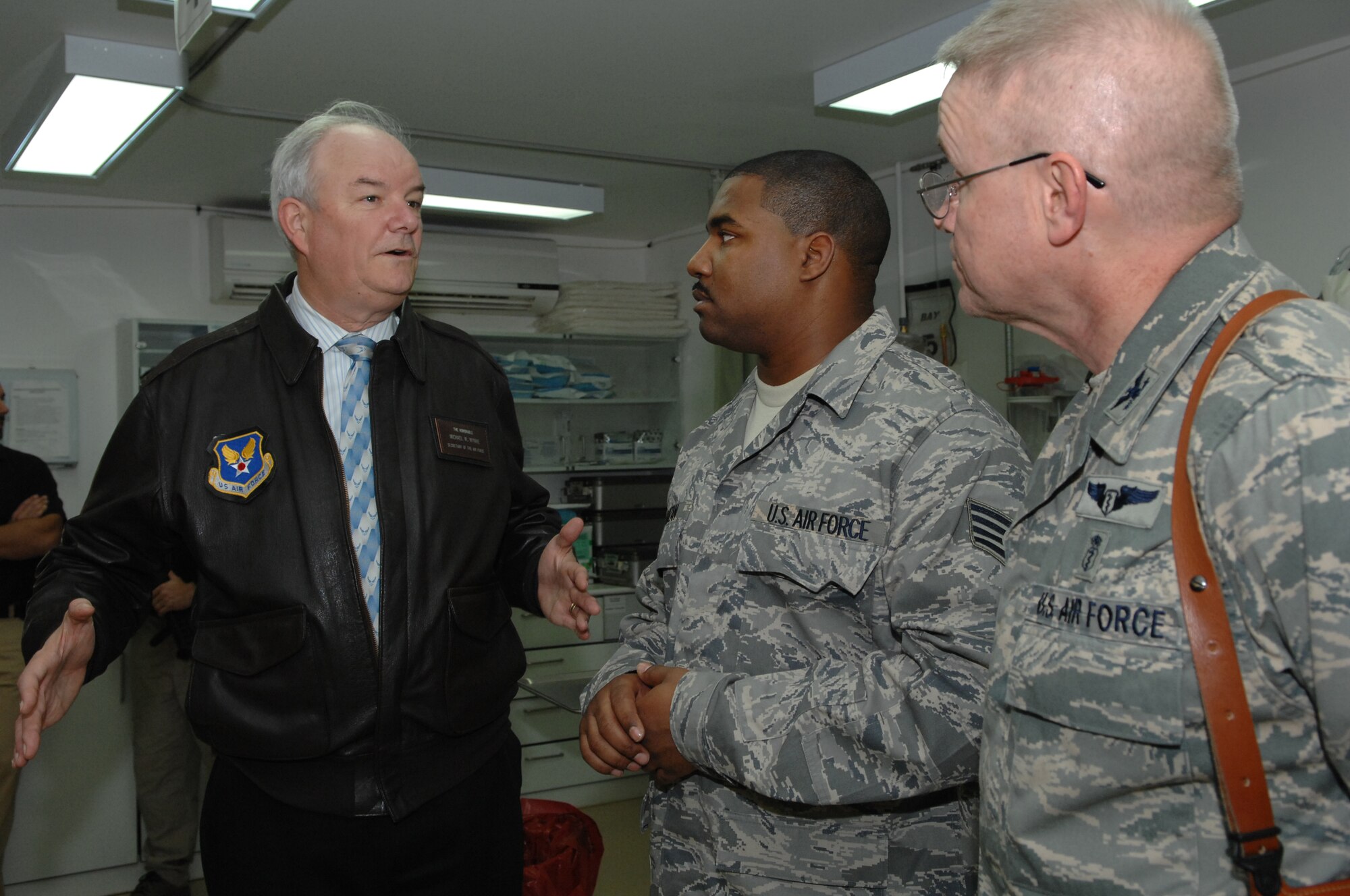 BALAD AIR BASE, Iraq -- Secretary of the Air Force Michael Wynne talks with Staff Sgt. Andre Rouzan, 332nd Expeditionary Medical Group technician, about the medical miracles that have taken place at the Air Force Theater Hospital here, Feb. 2. The hospital serves as the primary medical treatment facility for wounded servicemembers in Iraq. Sergeant Rouzan is deployed from Lackland Air Force Base, Texas. (U.S. Air Force photo/ Senior Airman Julianne Showalter)